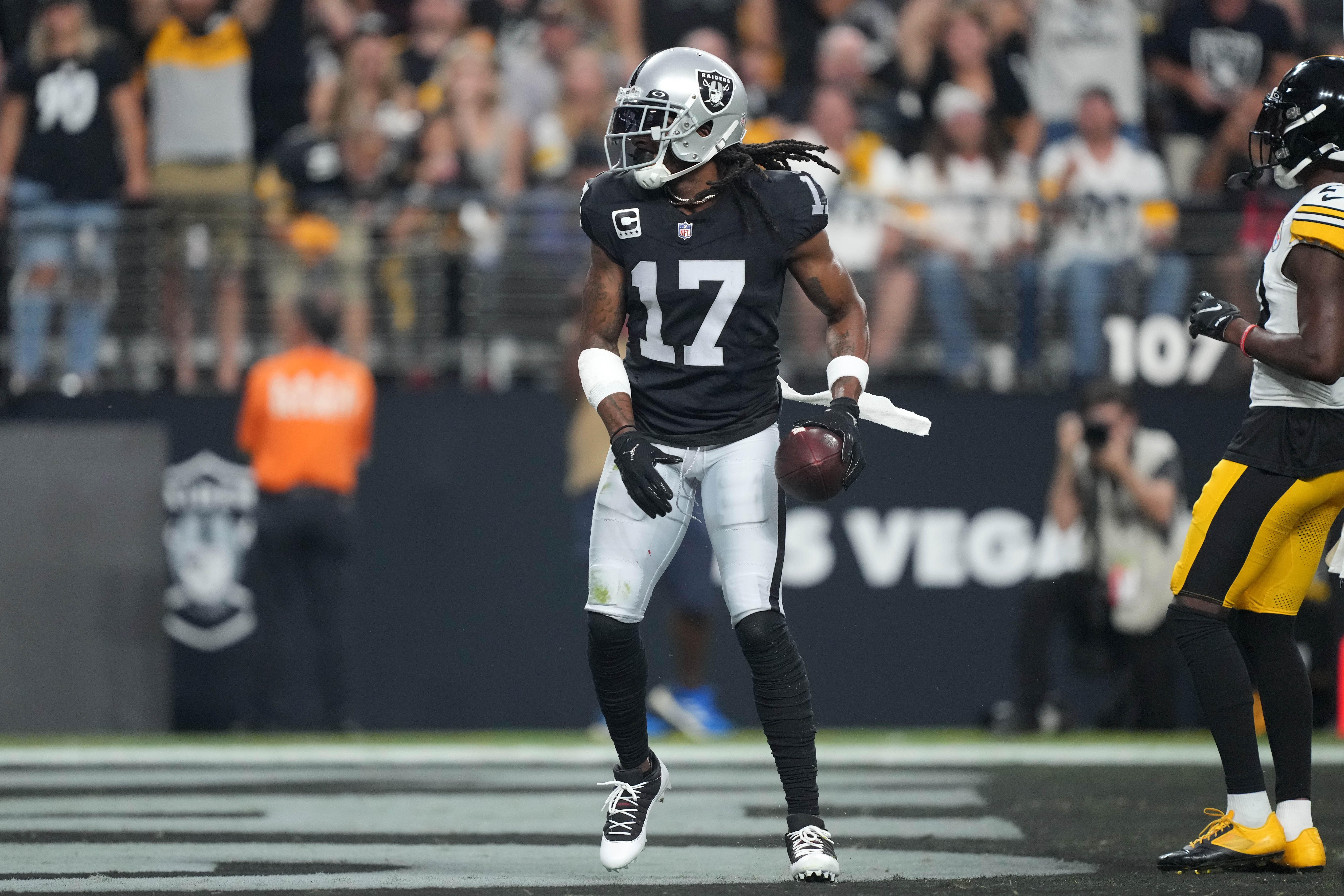 Las Vegas Raiders wide receiver Davante Adams (17) reacts after catching a touchdown pass against the Pittsburgh Steelers in the first half at Allegiant Stadium. Mandatory Credit: Kirby Lee-USA TODAY