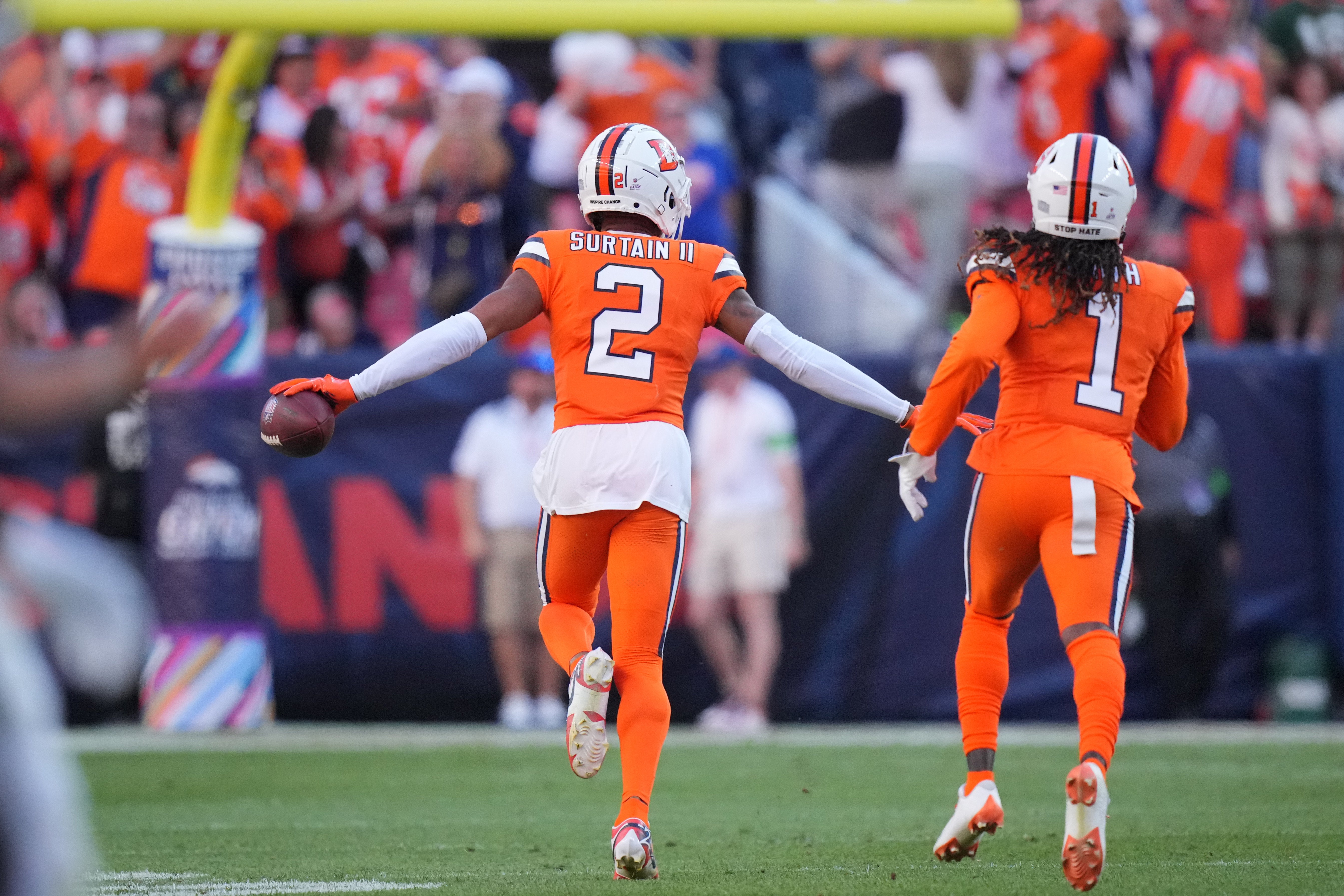 Denver Broncos cornerback Pat Surtain II (2) celebrates his interception with cornerback Tremon Smith (1) in the second half against the New York Jets at Empower Field at Mile High. Mandatory Credit: Ron Chenoy-USA TODAY Sports