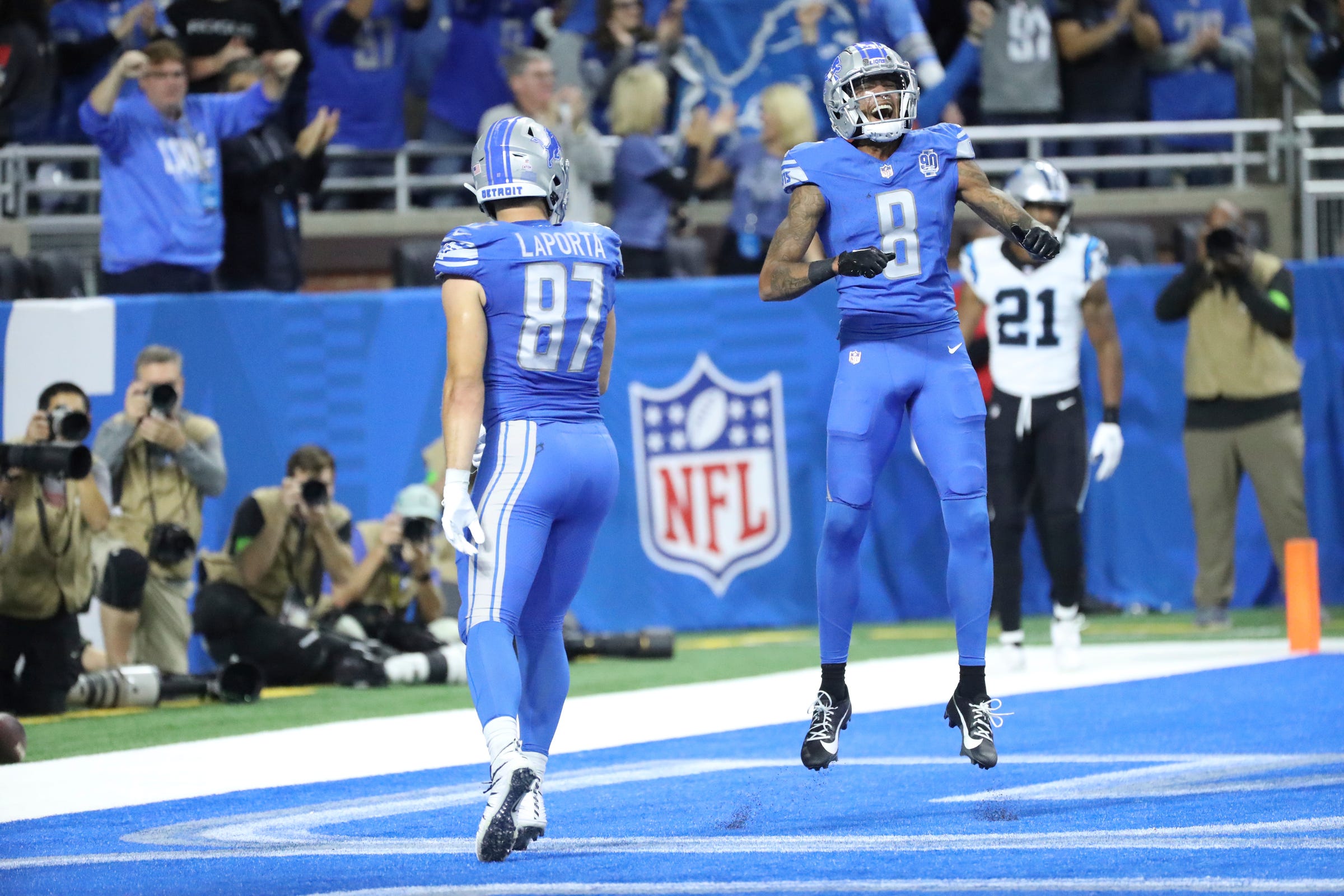 Detroit Lions tight end Sam LaPorta (87) celebrates his touchdown with wide receiver Josh Reynolds (8) during first-half action at Ford Field in Detroit on Sunday, Oct, 8, 2023.