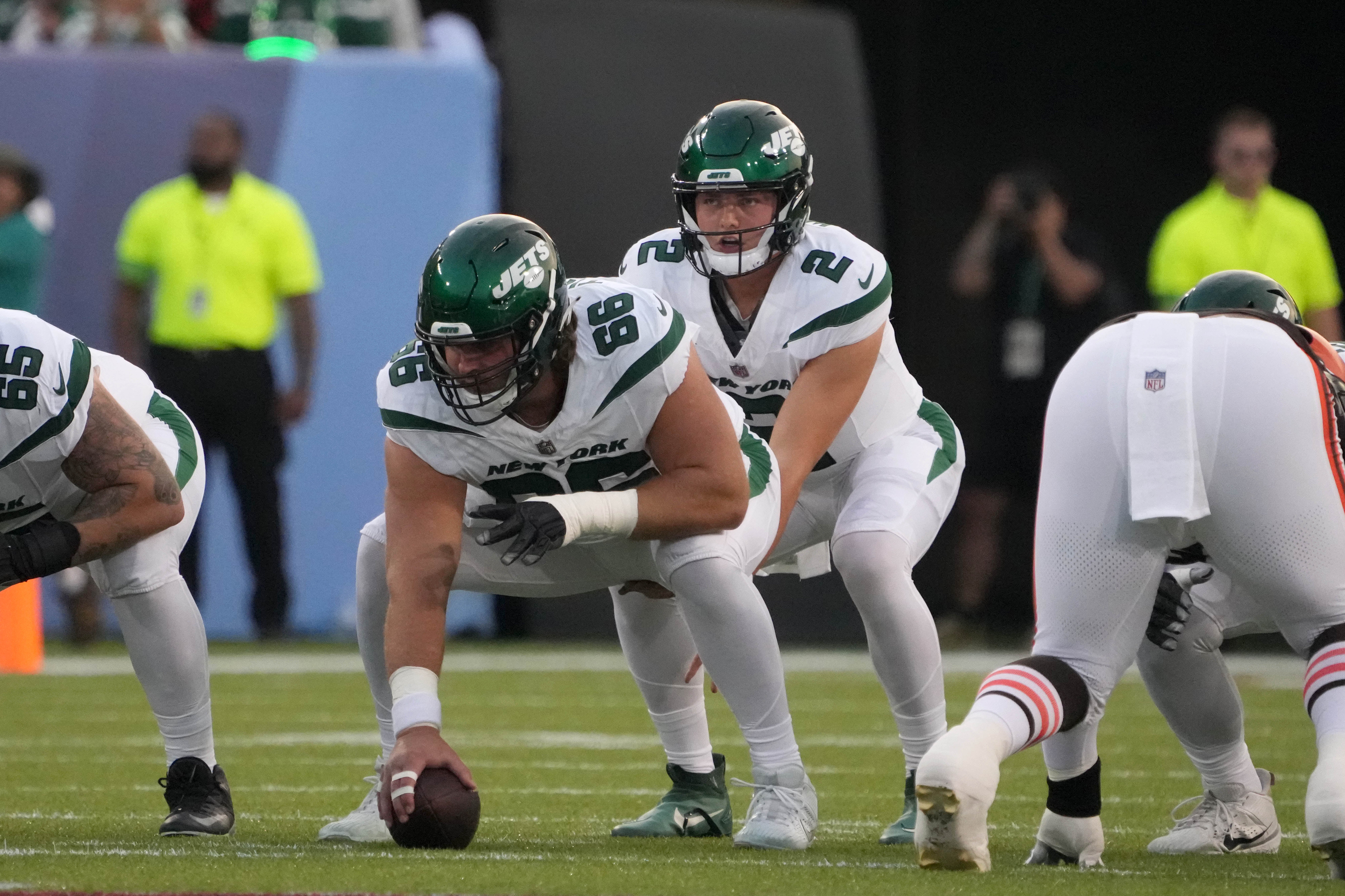 New York Jets quarterback Zach Wilson (2) takes the snap from center Joe Tippmann (66) against the Cleveland Browns during the first half at Tom Benson Hall of Fame Stadium.