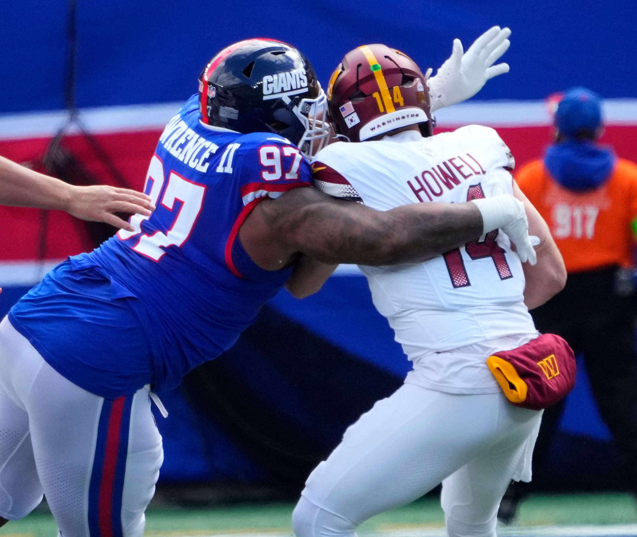 Giants defensive tackle Dexter Lawrence II (97) sacks Washington Commanders quarterback Sam Howell (14) in the first half at MetLife Stadium.