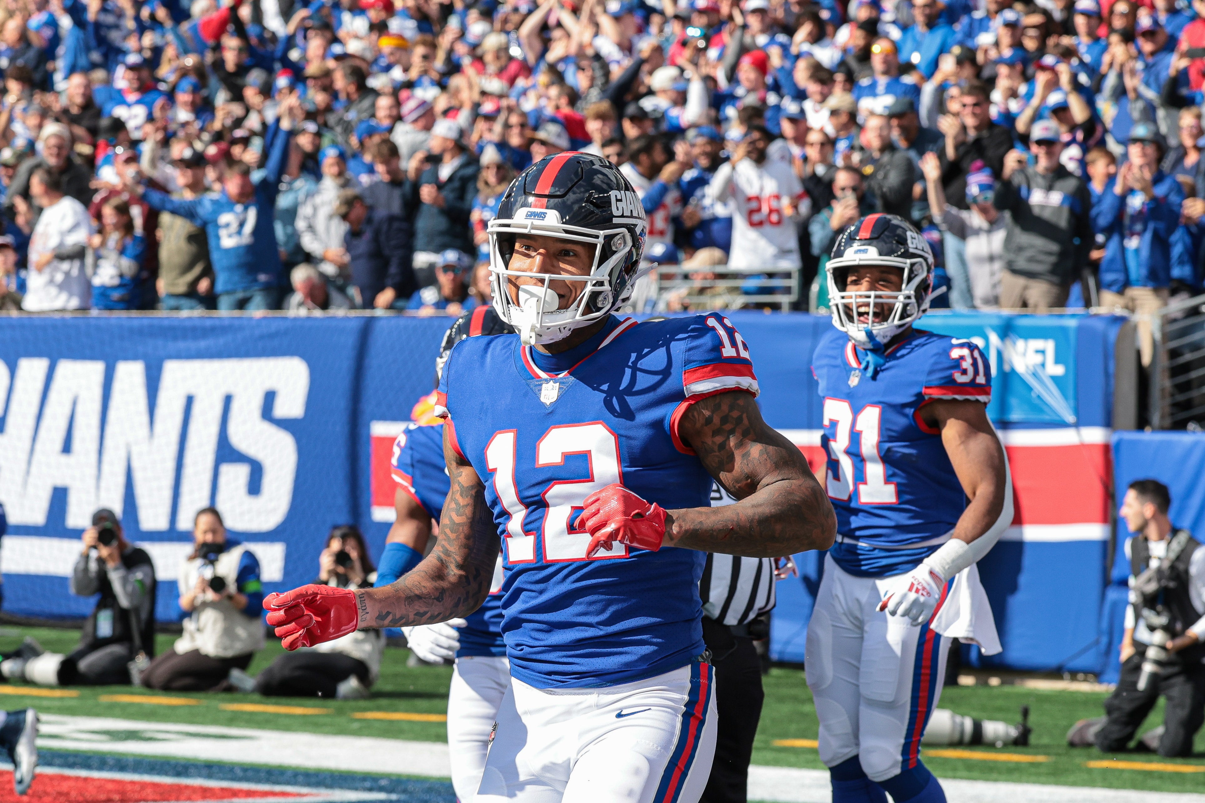 New York Giants tight end Darren Waller (12) celebrates his touchdown reception during the first half against the Washington Commanders at MetLife Stadium.