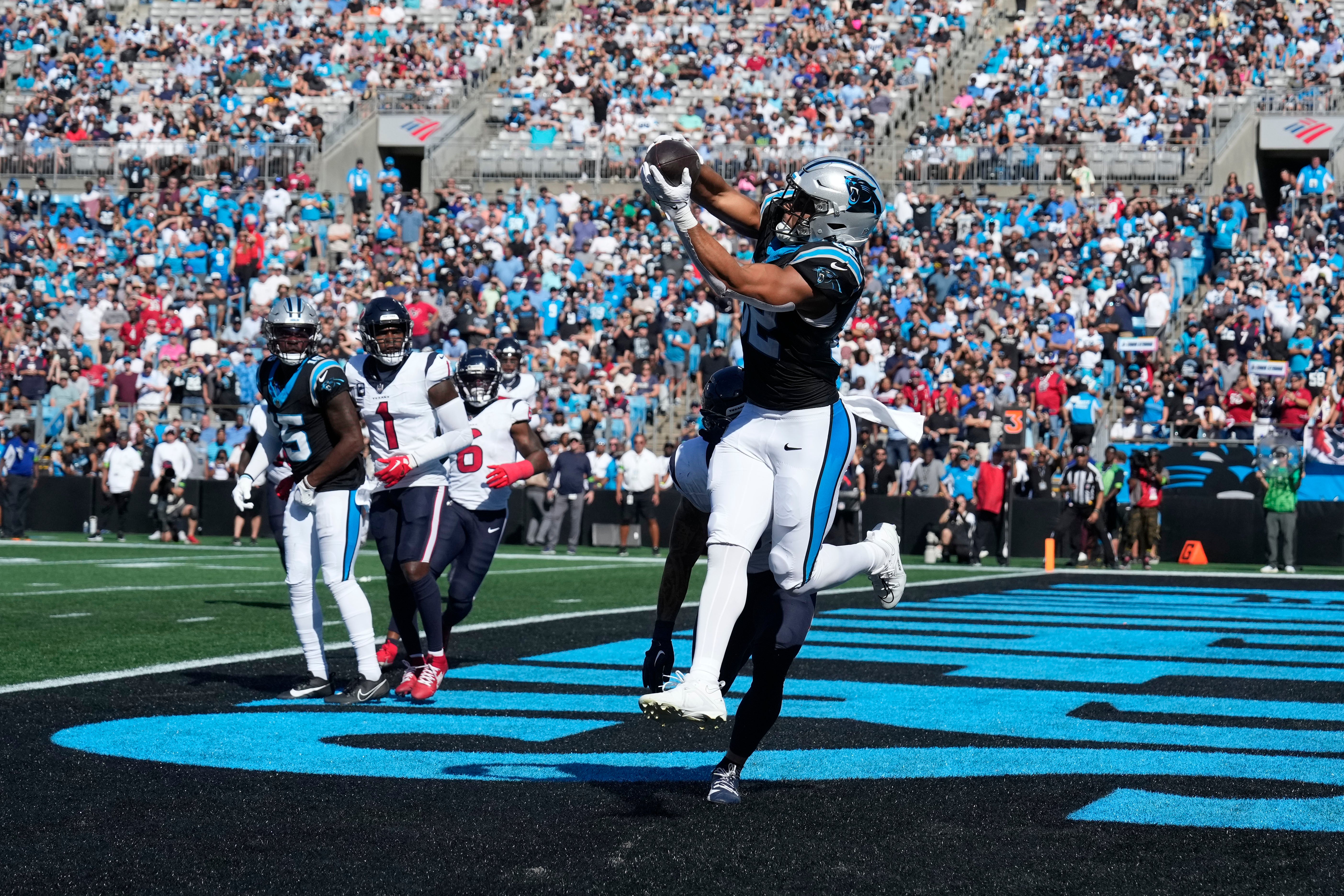 Oct 29, 2023; Charlotte, North Carolina, USA; Carolina Panthers tight end Tommy Tremble (82) catches a touchdown pass as Houston Texans linebacker Blake Cashman (53) defends in the second quarter at Bank of America Stadium. Mandatory Credit: Bob Donnan-USA TODAY Sports