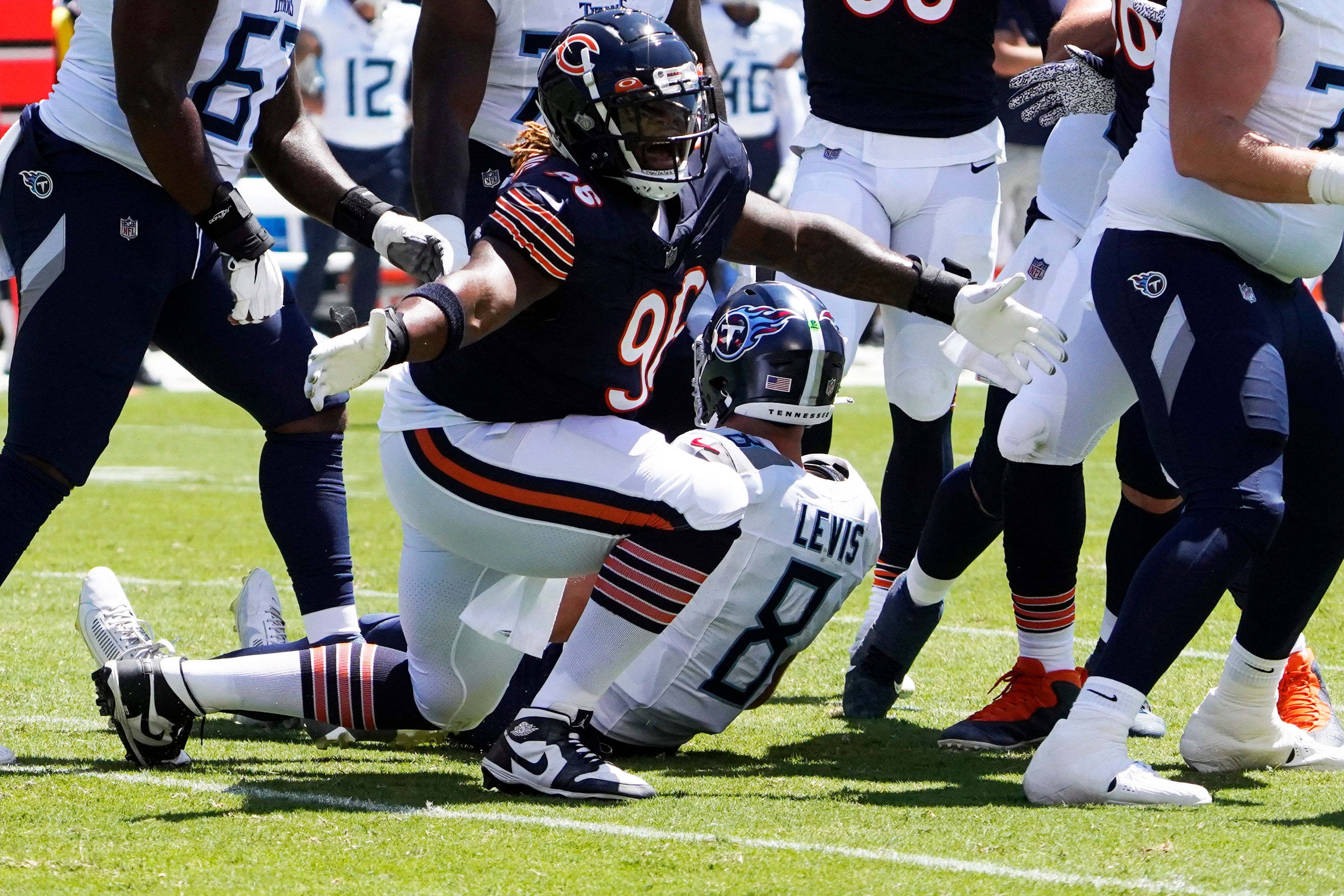 Aug 12, 2023; Chicago, Illinois, USA; Chicago Bears defensive tackle Zacch Pickens (96) sacks Tennessee Titans quarterback Will Levis (8) during the first quarter at Soldier Field.