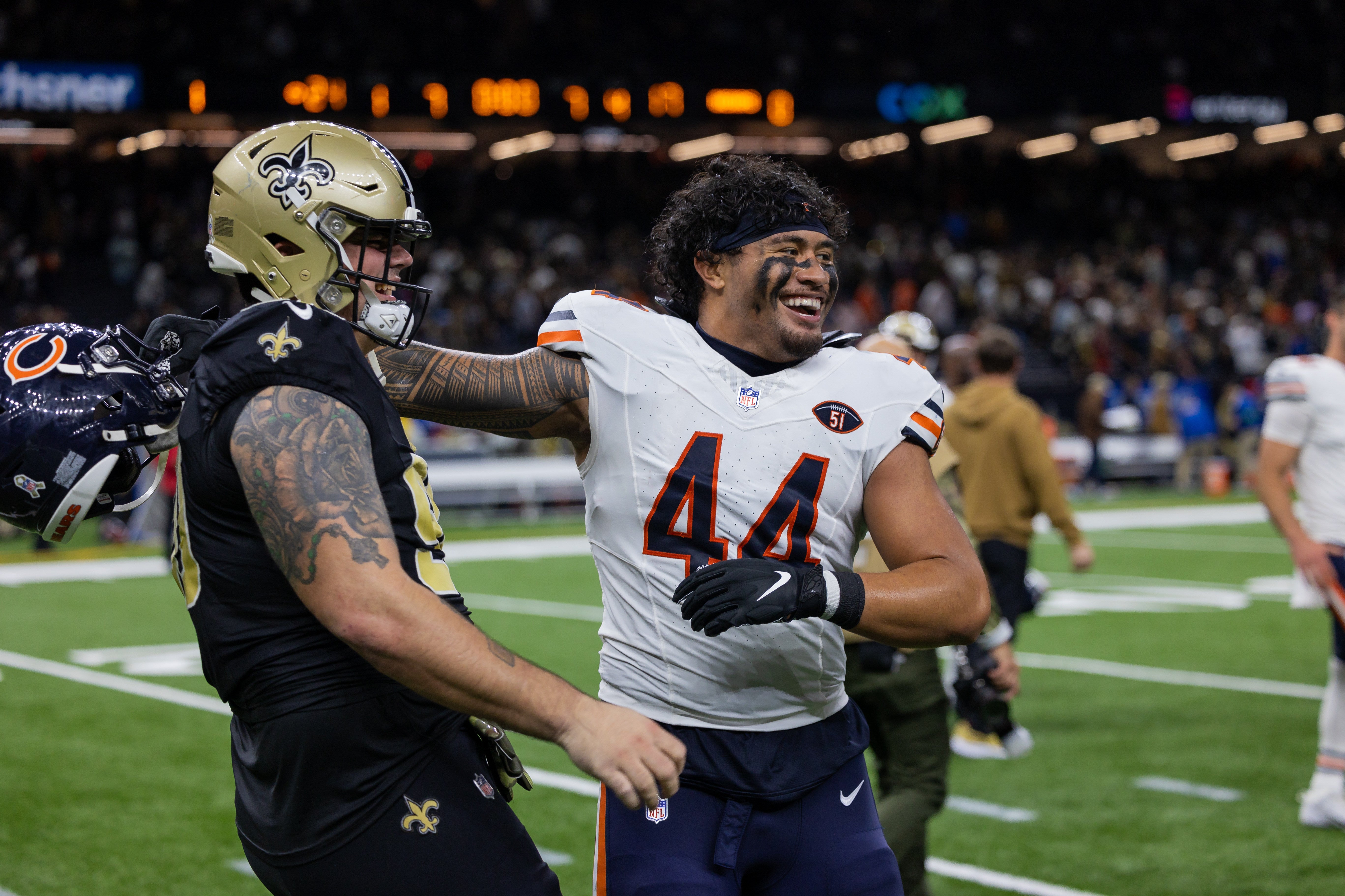 Nov 5, 2023; New Orleans, Louisiana, USA; New Orleans Saints defensive tackle Bryan Bresee (90) hugs Chicago Bears linebacker Noah Sewell (44) after the game at the Caesars Superdome.
