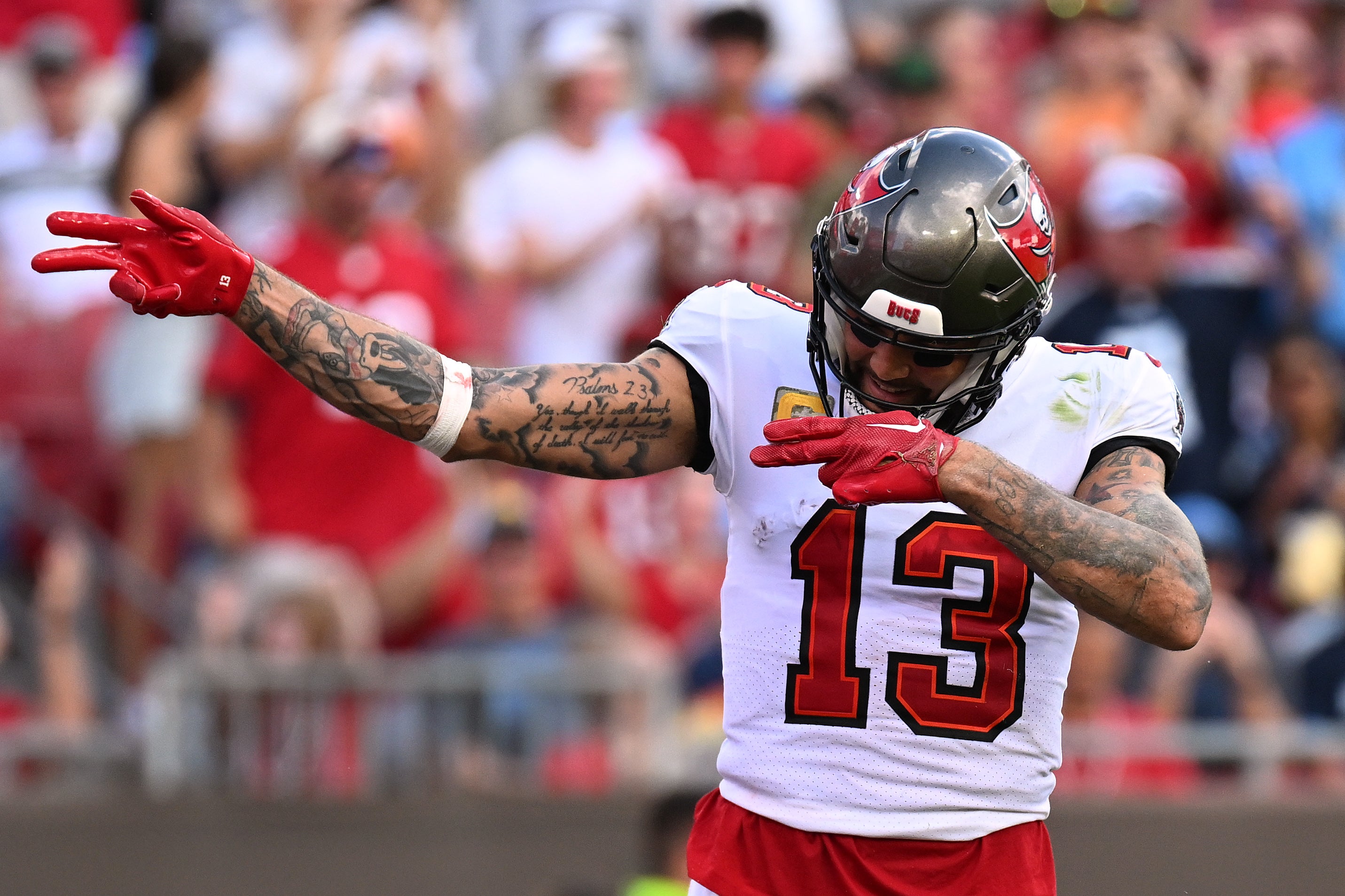 Nov 12, 2023; Tampa, Florida, USA; Tampa Bay Buccaneers wide receiver Mike Evans (13) celebrates after a reception in the second half against the Tennessee Titans at Raymond James Stadium.