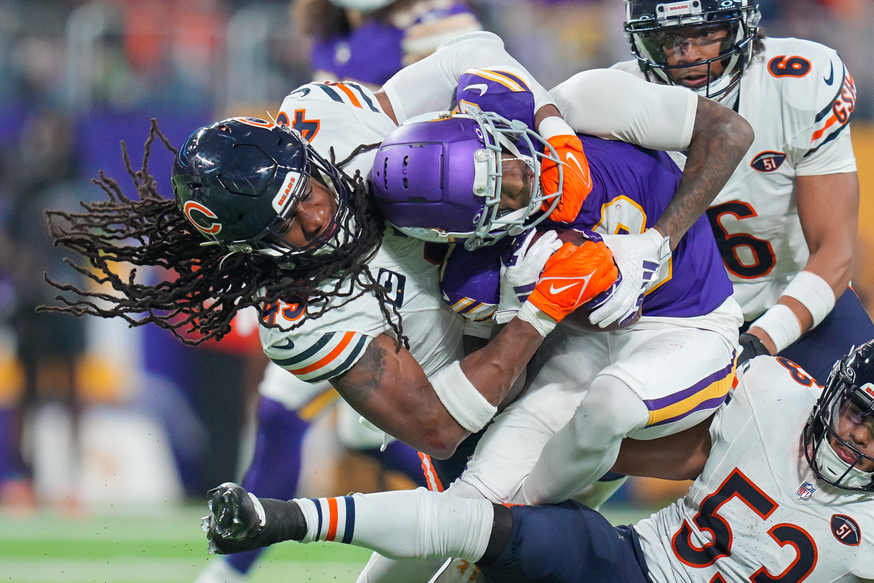 Nov 27, 2023; Minneapolis, Minnesota, USA; Chicago Bears linebacker Tremaine Edmunds (49) tackles Minnesota Vikings wide receiver Jordan Addison (3) in the fourth quarter at U.S. Bank Stadium.