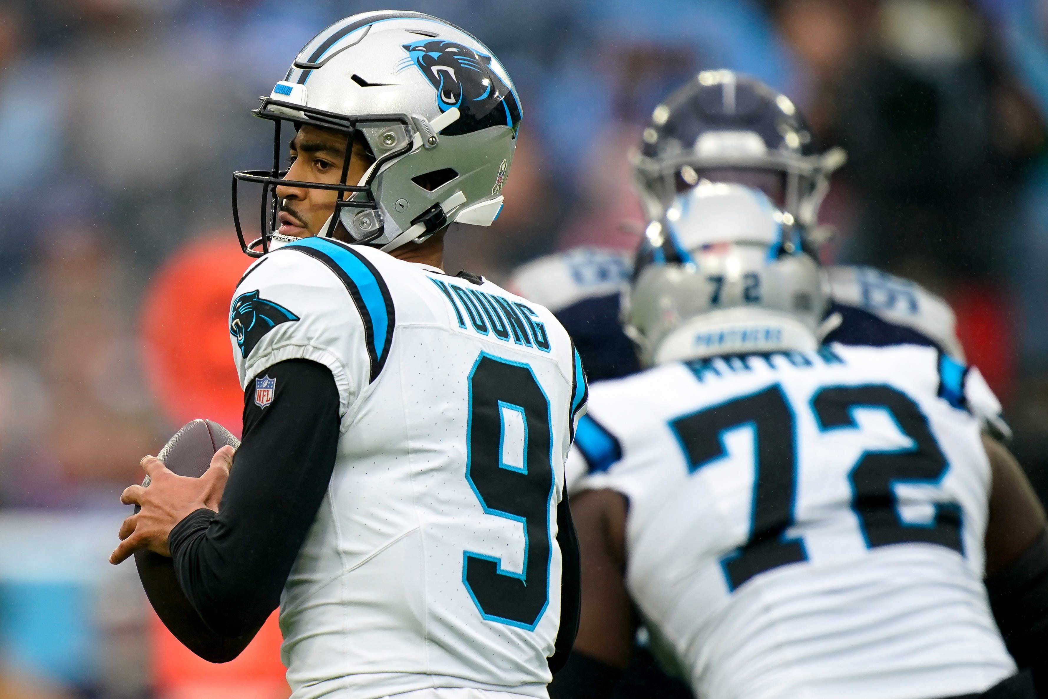 Carolina Panthers quarterback Bryce Young (9) looks for a receiver against the Tennessee Titans during the second quarter at Nissan Stadium in Nashville, Tenn., Sunday, Nov. 26, 2023.