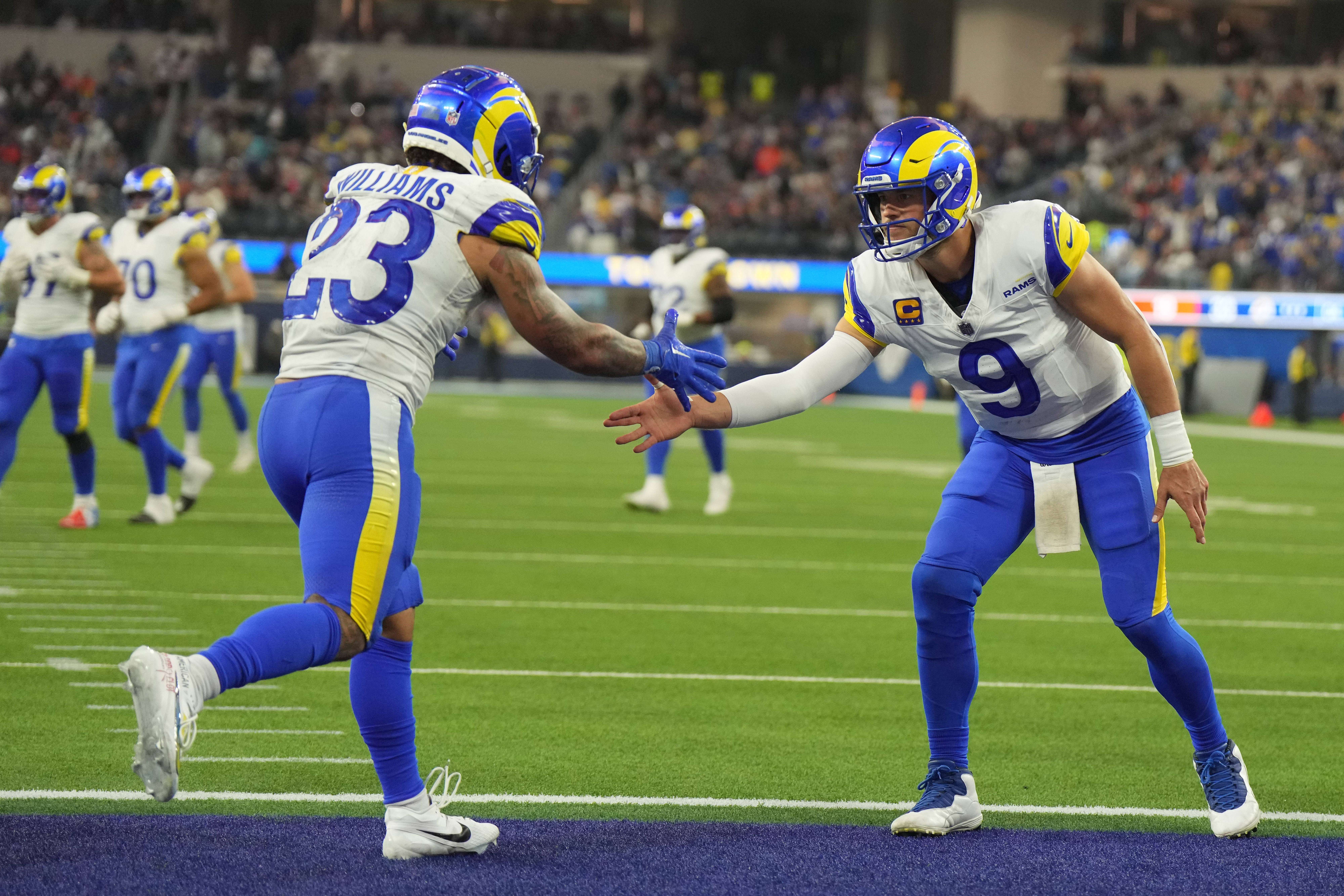 Dec 3, 2023; Inglewood, California, USA; Los Angeles Rams running back Kyren Williams (23) celebrates with quarterback Matthew Stafford (9) in the fourth quarter against the Cleveland Browns SoFi Stadium. Mandatory Credit: Kirby Lee-USA TODAY Sports