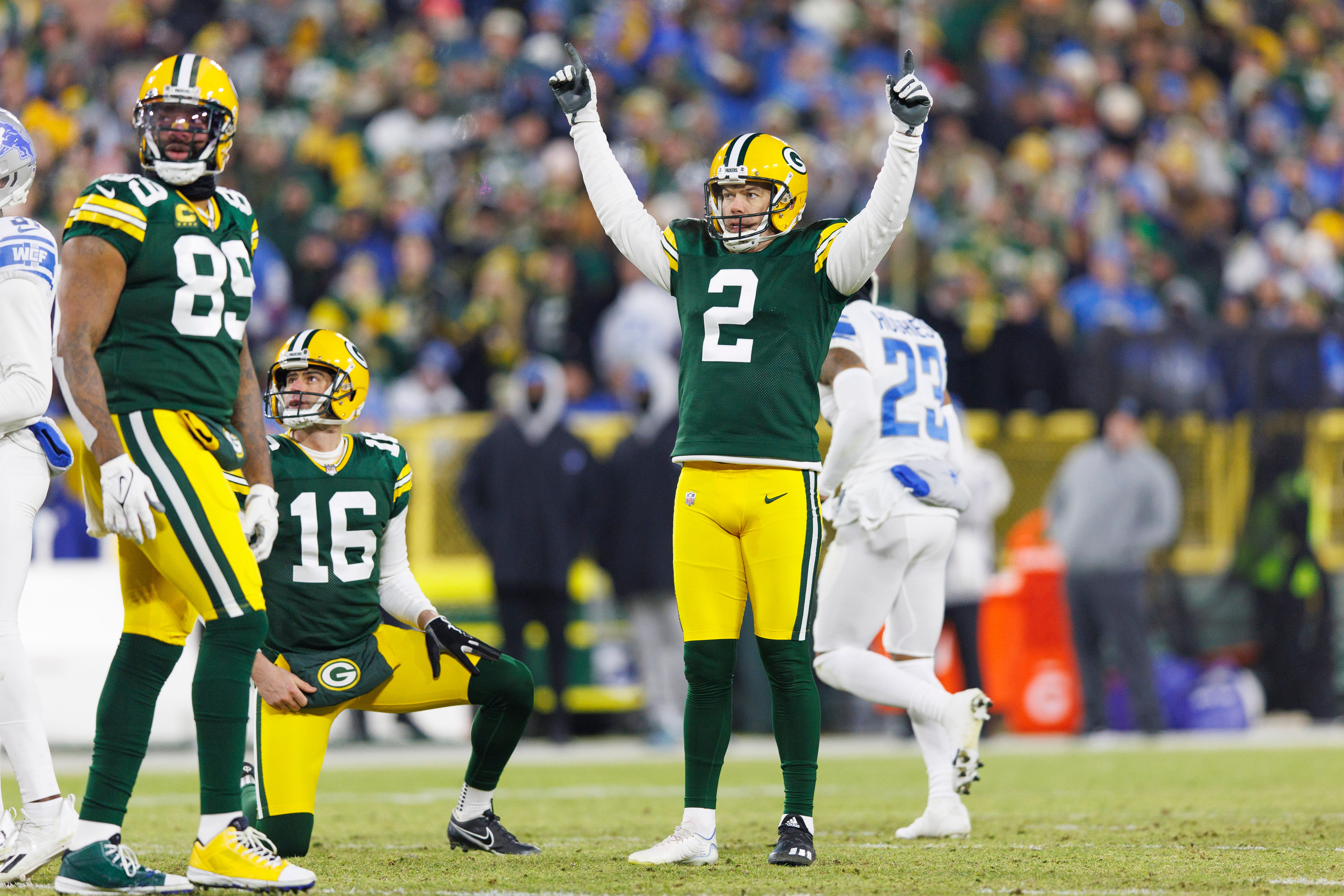 Jan 8, 2023; Green Bay, Wisconsin, USA; Green Bay Packers kicker Mason Crosby (2) celebrates after making a field goal during the second quarter against the Detroit Lions at Lambeau Field. Mandatory Credit: Jeff Hanisch-USA TODAY Sports