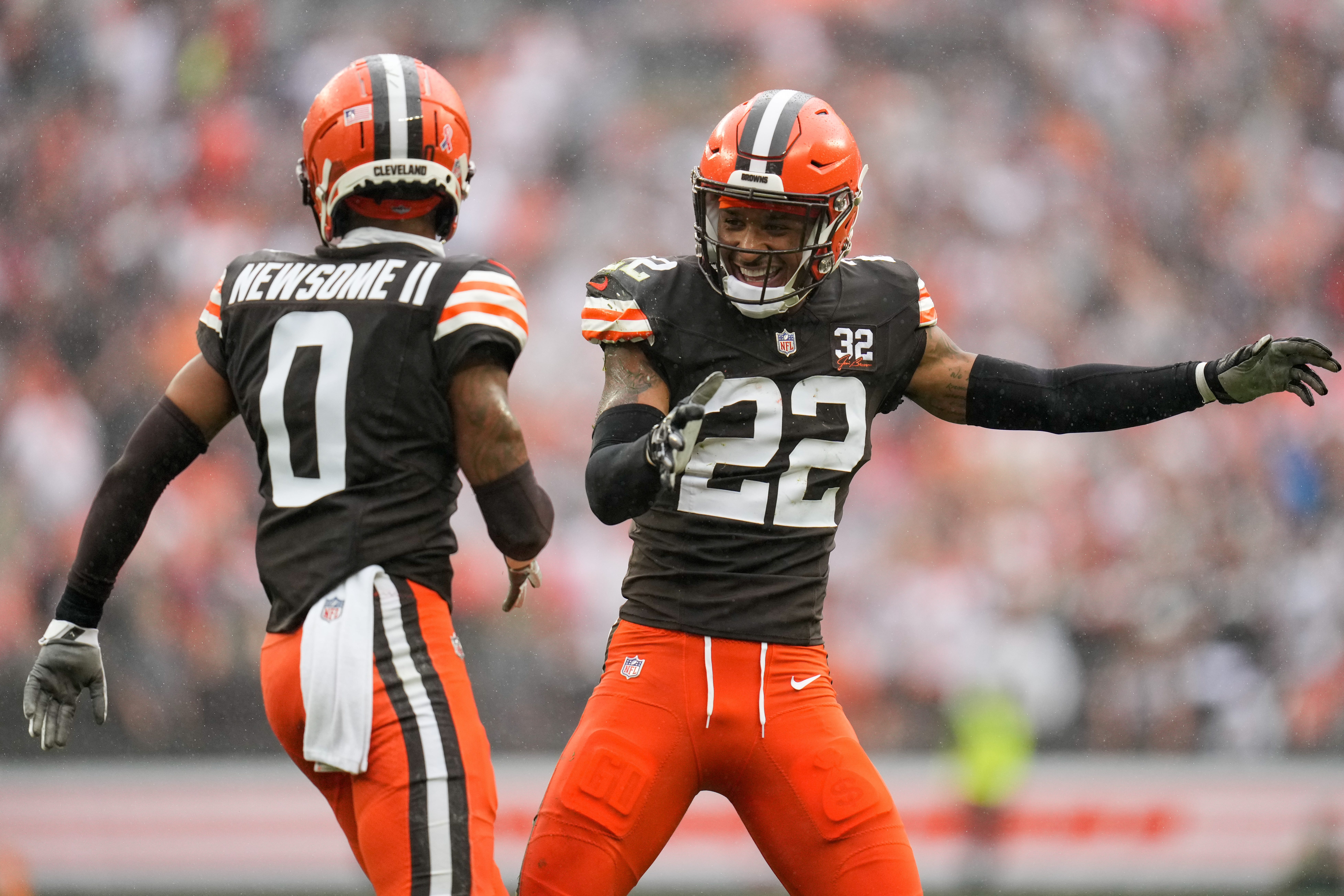 Cleveland Browns cornerback Greg Newsome II (0) and safety Grant Delpit (22) celebrate a stop in the first quarter of the NFL Week 1 game between the Cleveland Browns and the Cincinnati Bengals at FirstEnergy Stadium in downtown Cleveland on Sunday, Sept. 10, 2023. The Browns led 10-0 at halftime.