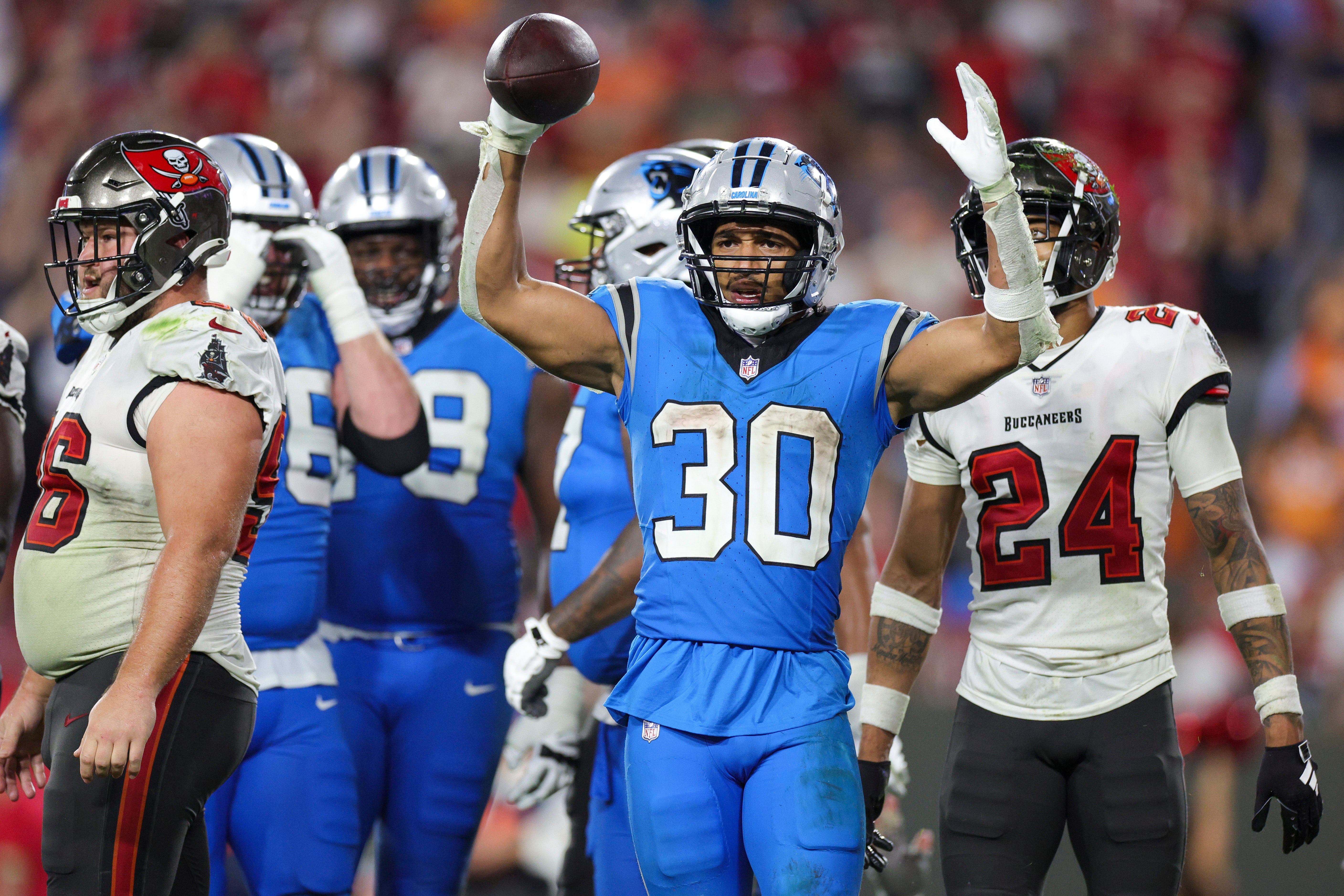 Dec 3, 2023; Tampa, Florida, USA; Carolina Panthers running back Chuba Hubbard (30) celebrates after a touchdown against the Tampa Bay Buccaneers in the fourth quarter at Raymond James Stadium. Mandatory Credit: Nathan Ray Seebeck-USA TODAY Sports