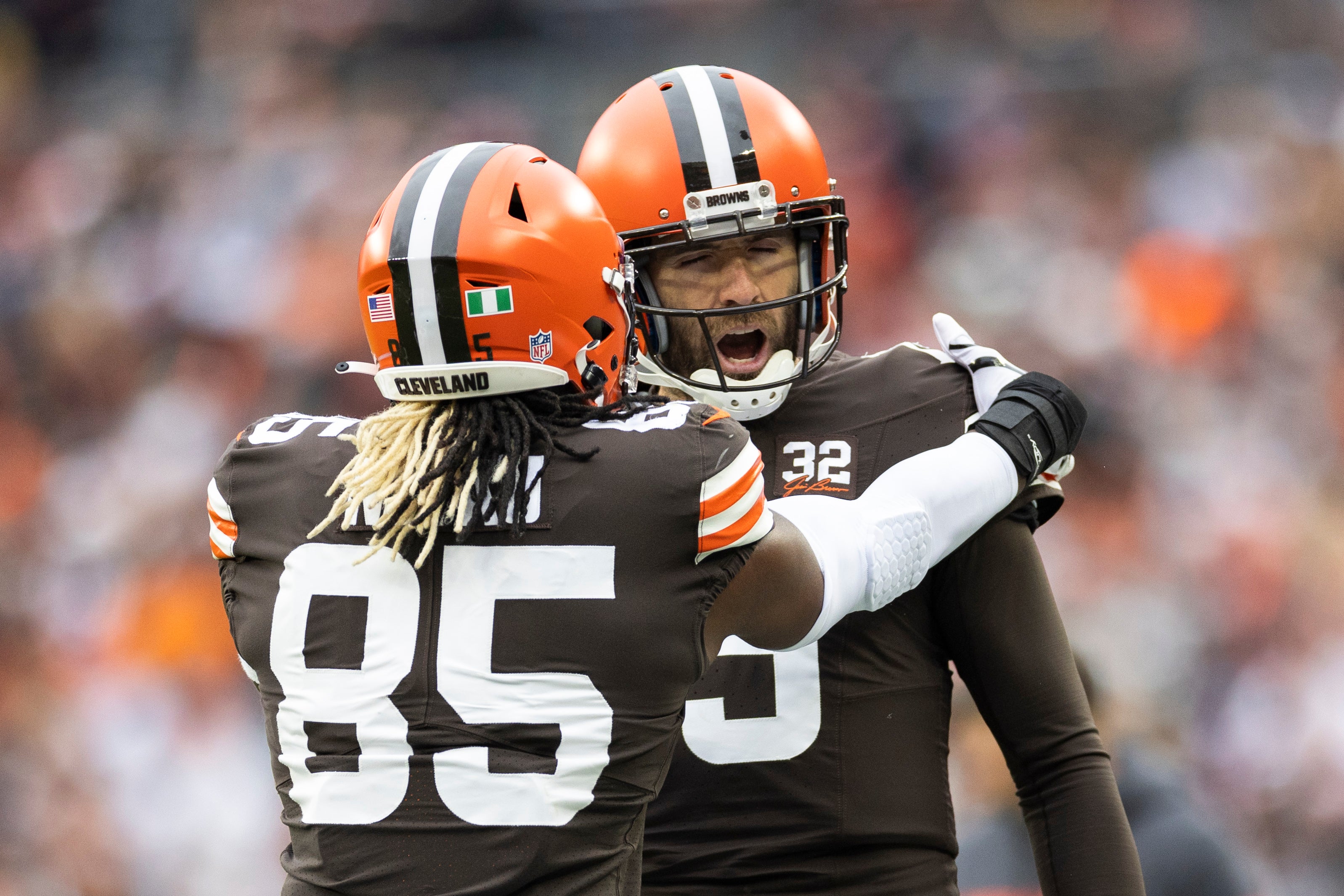 Dec 10, 2023; Cleveland, Ohio, USA; Cleveland Browns quarterback Joe Flacco (15) congratulates tight end David Njoku (85) on his touchdown run against the Jacksonville Jaguars during the second quarter at Cleveland Browns Stadium. Mandatory Credit: Scott Galvin-USA TODAY Sports