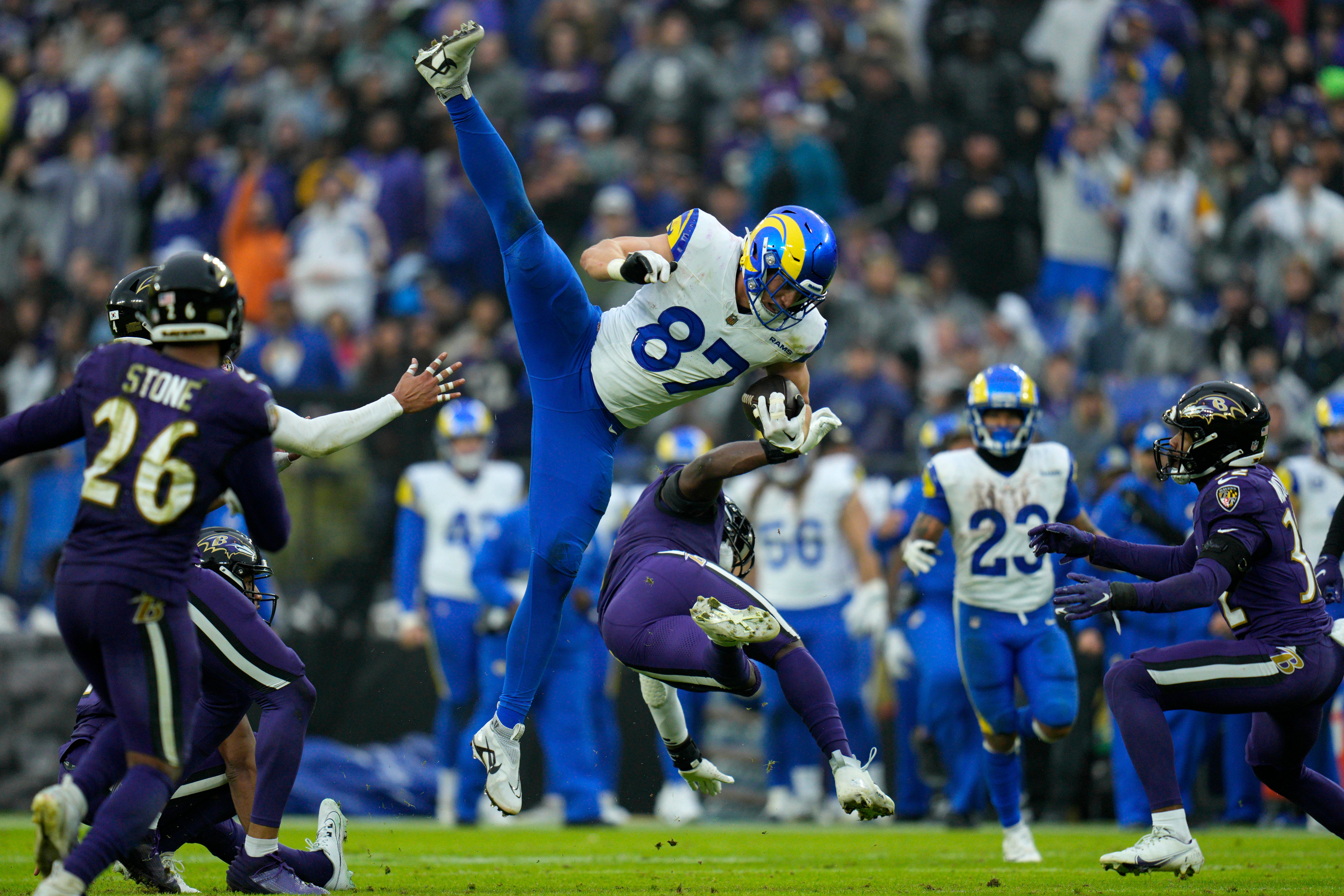 Dec 10, 2023; Baltimore, Maryland, USA; Los Angeles Rams tight end Davis Allen (87) tries to leap over Baltimore Ravens linebacker Roquan Smith (0) during the second quarter at M&T Bank Stadium. Mandatory Credit: Jessica Rapfogel-USA TODAY Sports