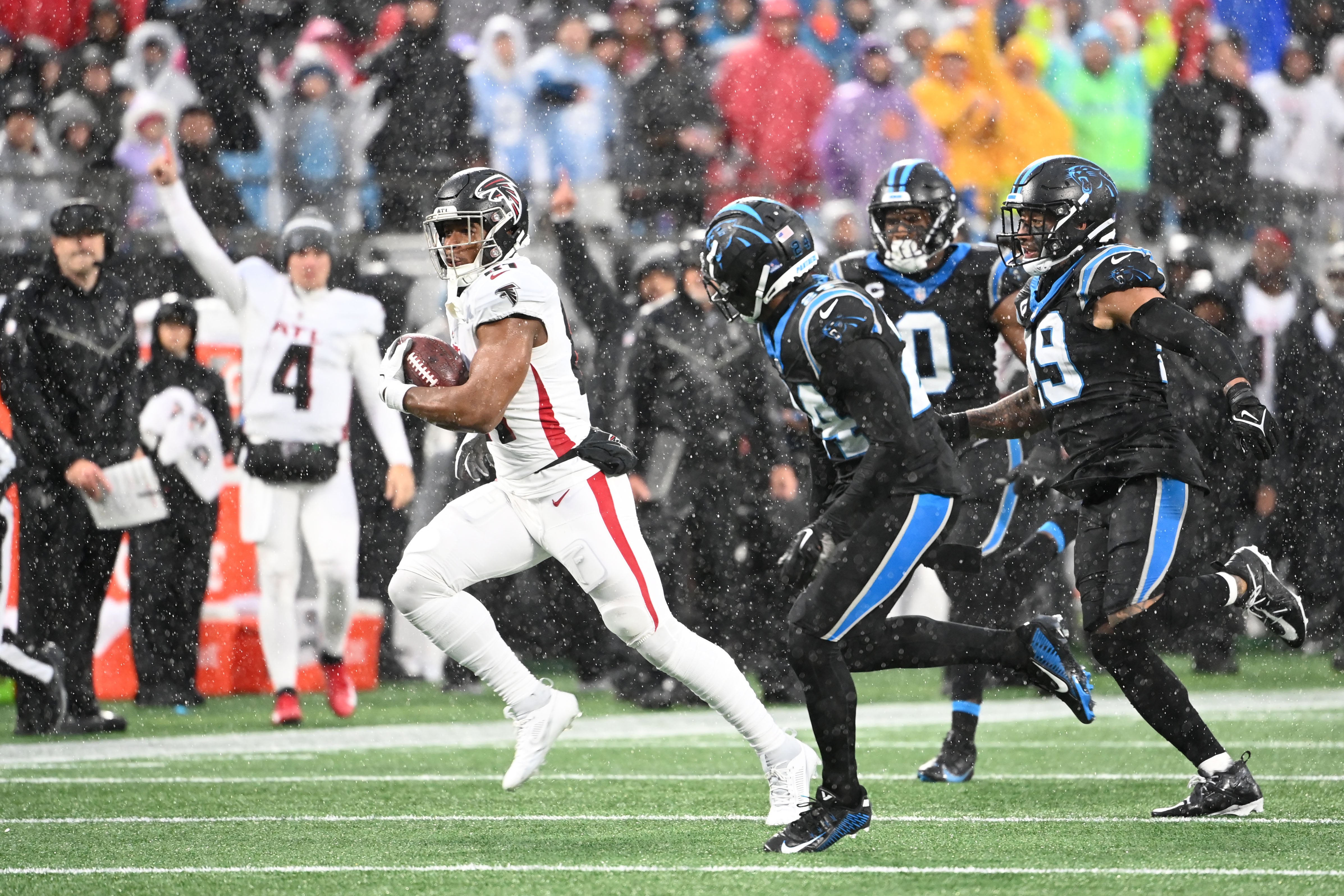 Dec 17, 2023; Charlotte, North Carolina, USA; Atlanta Falcons tight end Jonnu Smith (81) with the ball as Carolina Panthers safety Vonn Bell (24) and linebackers Brian Burns (0) and Frankie Luvu (49) defend in the second quarter at Bank of America Stadium. Mandatory Credit: Bob Donnan-USA TODAY Sports