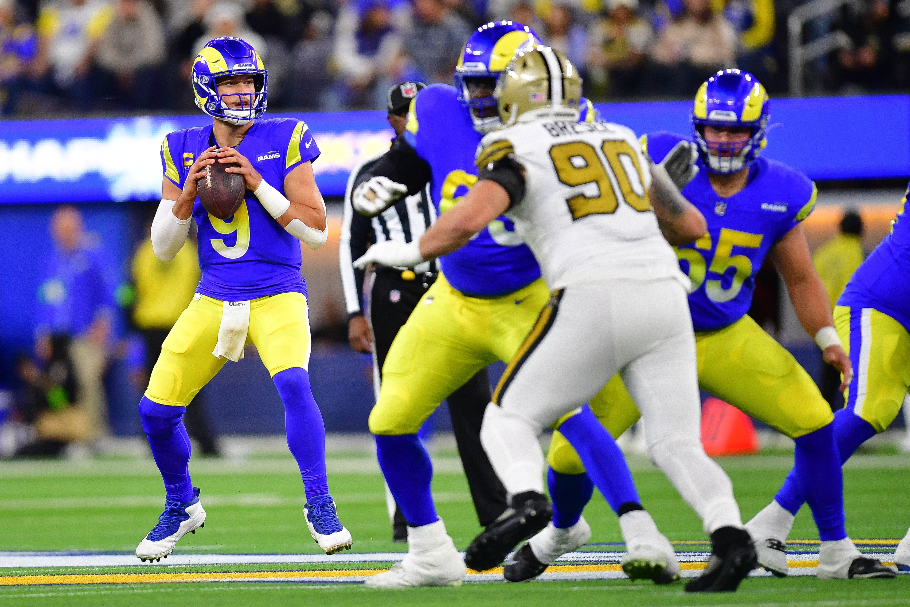 Dec 21, 2023; Inglewood, California, USA; Los Angeles Rams quarterback Matthew Stafford (9) drops back to pass against the New Orleans Saints during the first half at SoFi Stadium. Mandatory Credit: Gary A. Vasquez-USA TODAY Sports