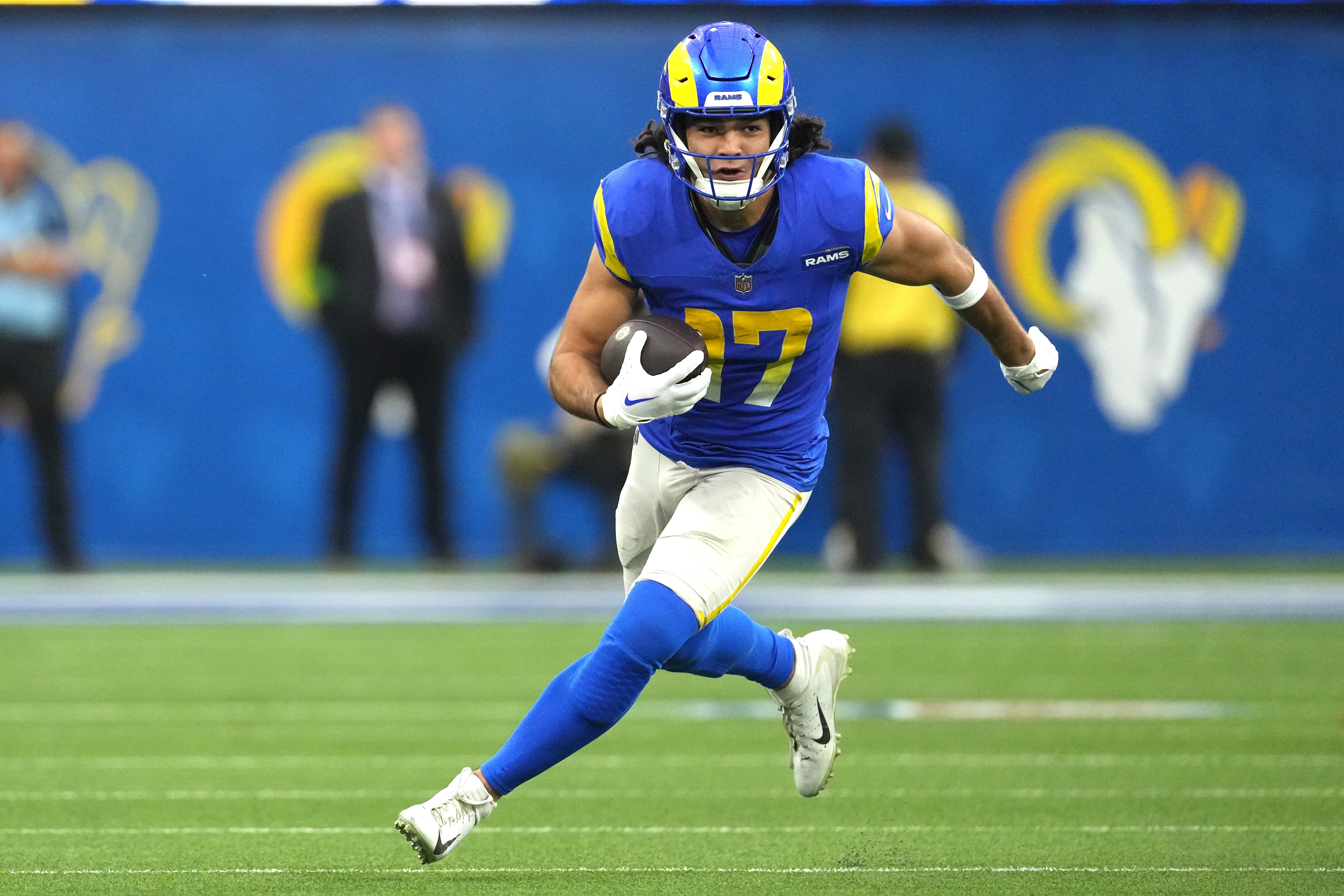 Dec 17, 2023; Inglewood, California, USA; Los Angeles Rams wide receiver Puka Nacua (17) carries the ball against the Washington Commanders in the second half at SoFi Stadium. Mandatory Credit: Kirby Lee-USA TODAY Sports