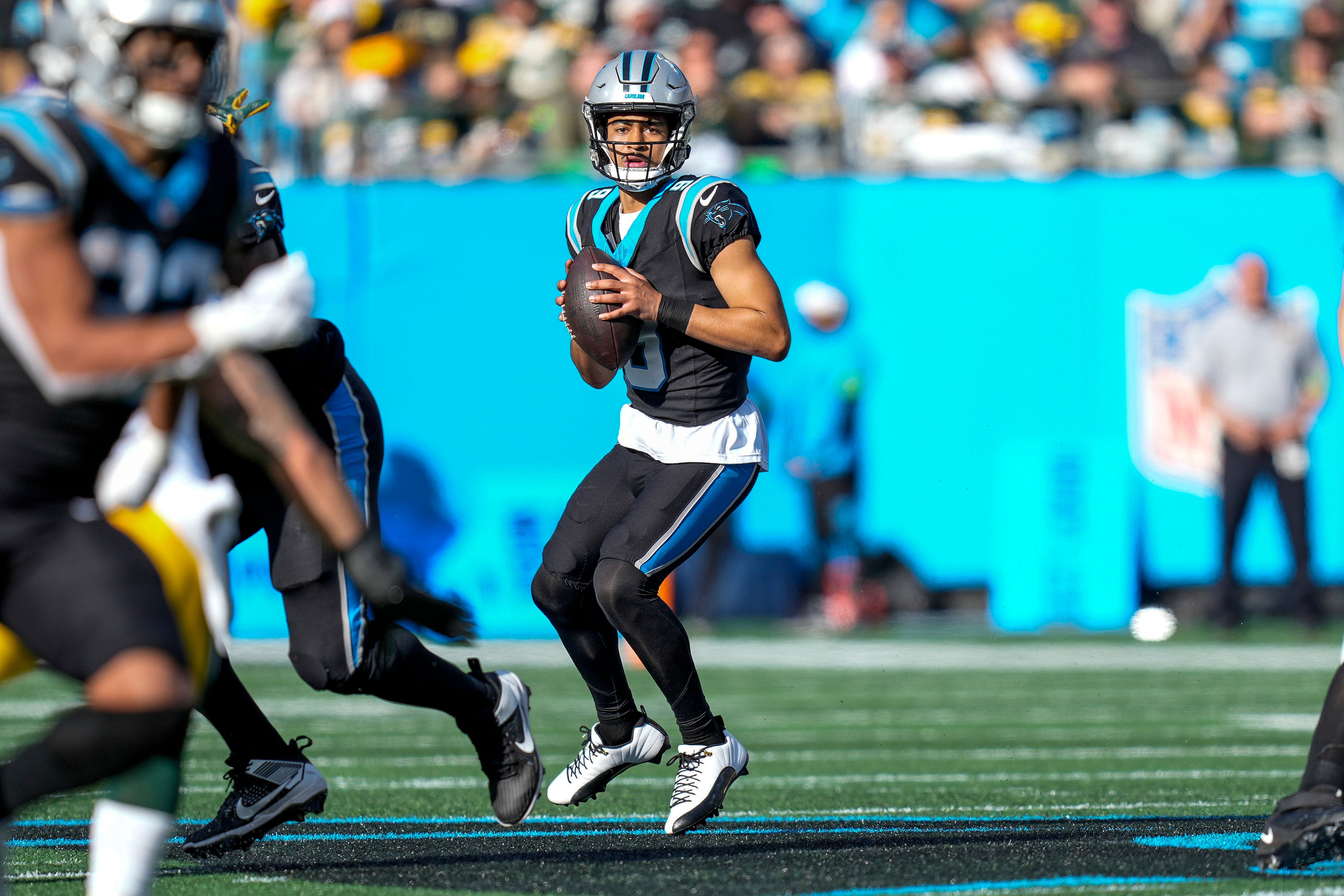 Dec 24, 2023; Charlotte, North Carolina, USA; Carolina Panthers quarterback Bryce Young (9) looks for a receiver against the Green Bay Packers during the second quarter at Bank of America Stadium. Mandatory Credit: Jim Dedmon-USA TODAY Sports
