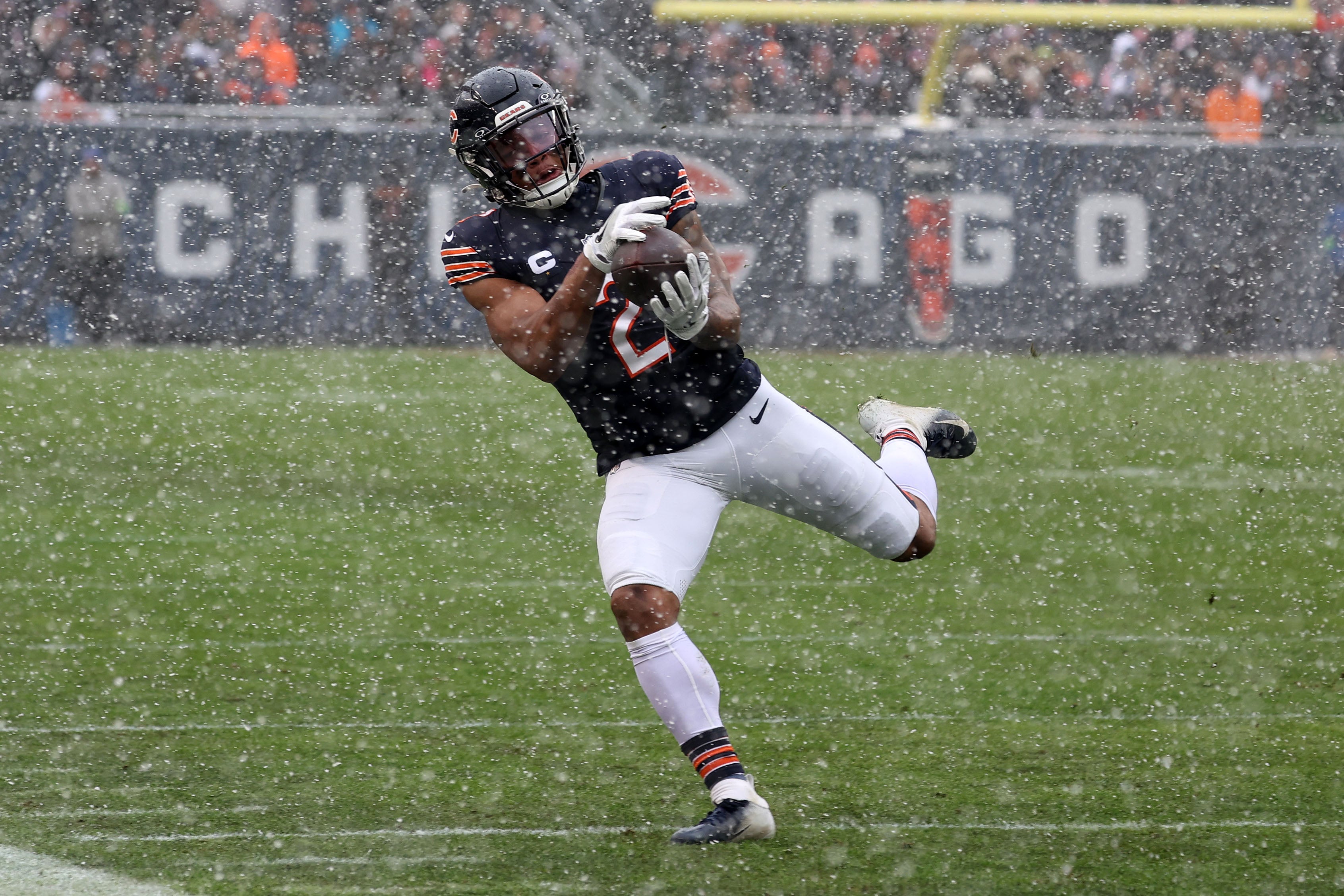 Dec 31, 2023; Chicago, Illinois, USA; Chicago Bears wide receiver DJ Moore (2) makes a catch over the Atlanta Falcons during the first half at Soldier Field. Mandatory Credit: Mike Dinovo-USA TODAY Sports