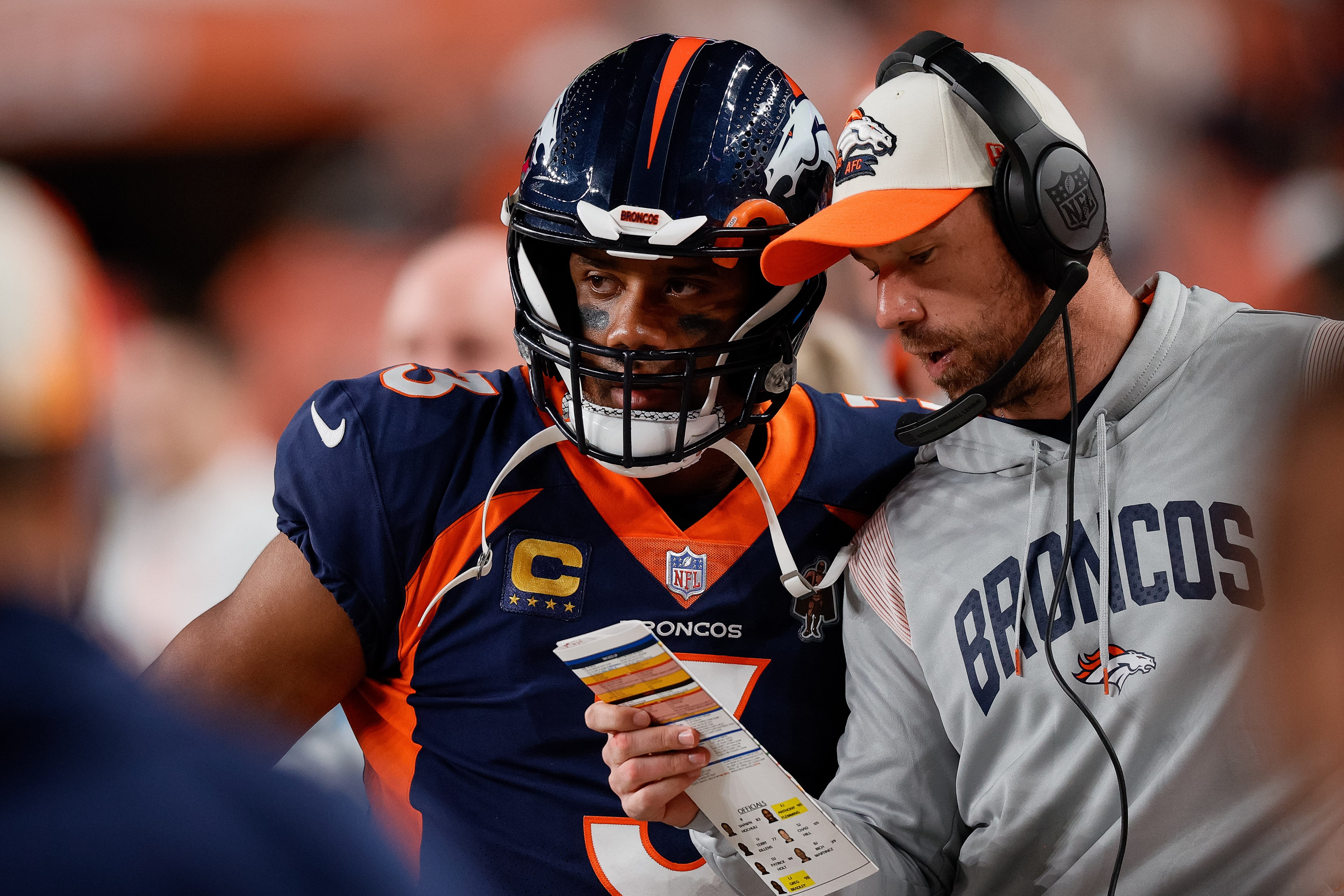 Sep 25, 2022; Denver, Colorado, USA; Denver Broncos quarterback Russell Wilson (3) talks with quarterbacks coach Klint Kubiak in the second quarter against the San Francisco 49ers at Empower Field at Mile High. Mandatory Credit: