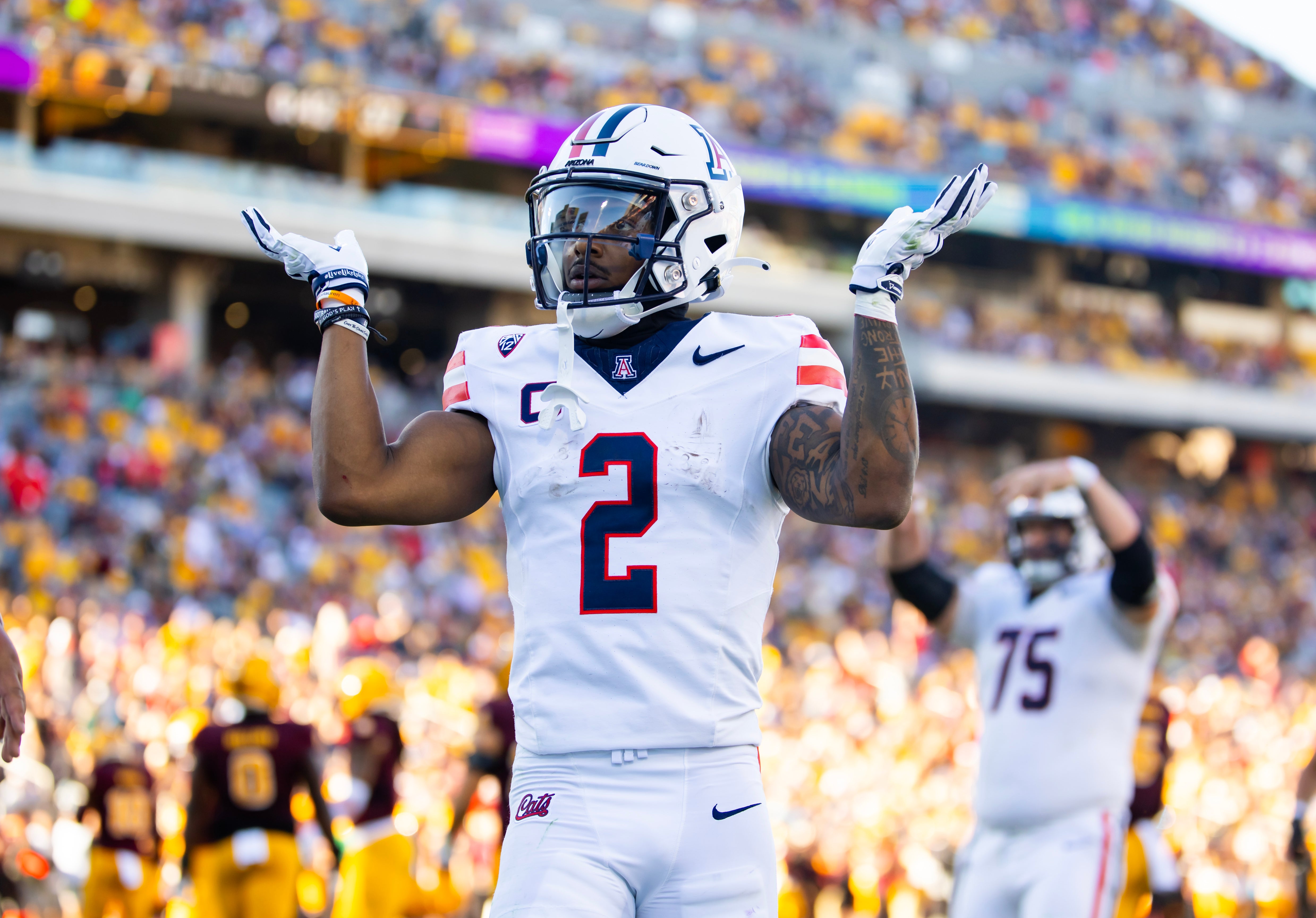 Nov 25, 2023; Tempe, Arizona, USA; Arizona Wildcats running back Jacob Cowing (2) reacts after a touchdown against the Arizona State Sun Devils in the second half of the Territorial Cup at Mountain America Stadium.