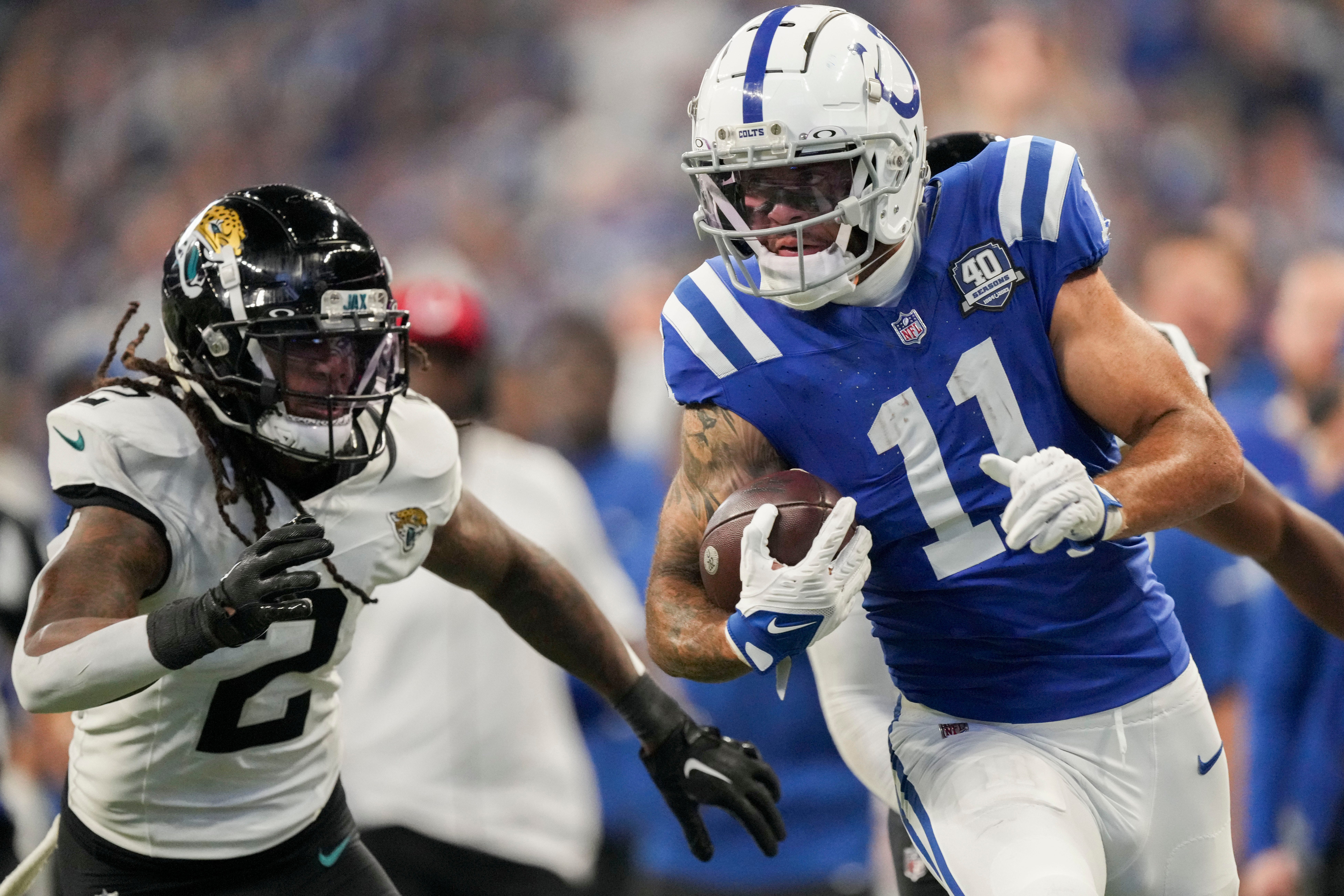 Jacksonville Jaguars safety Rayshawn Jenkins (2) chases after Indianapolis Colts wide receiver Michael Pittman Jr. (11) as he rushes in a touchdown Sunday, Sept. 10, 2023, during a game against the Jacksonville Jaguars at Lucas Oil Stadium in Indianapolis.