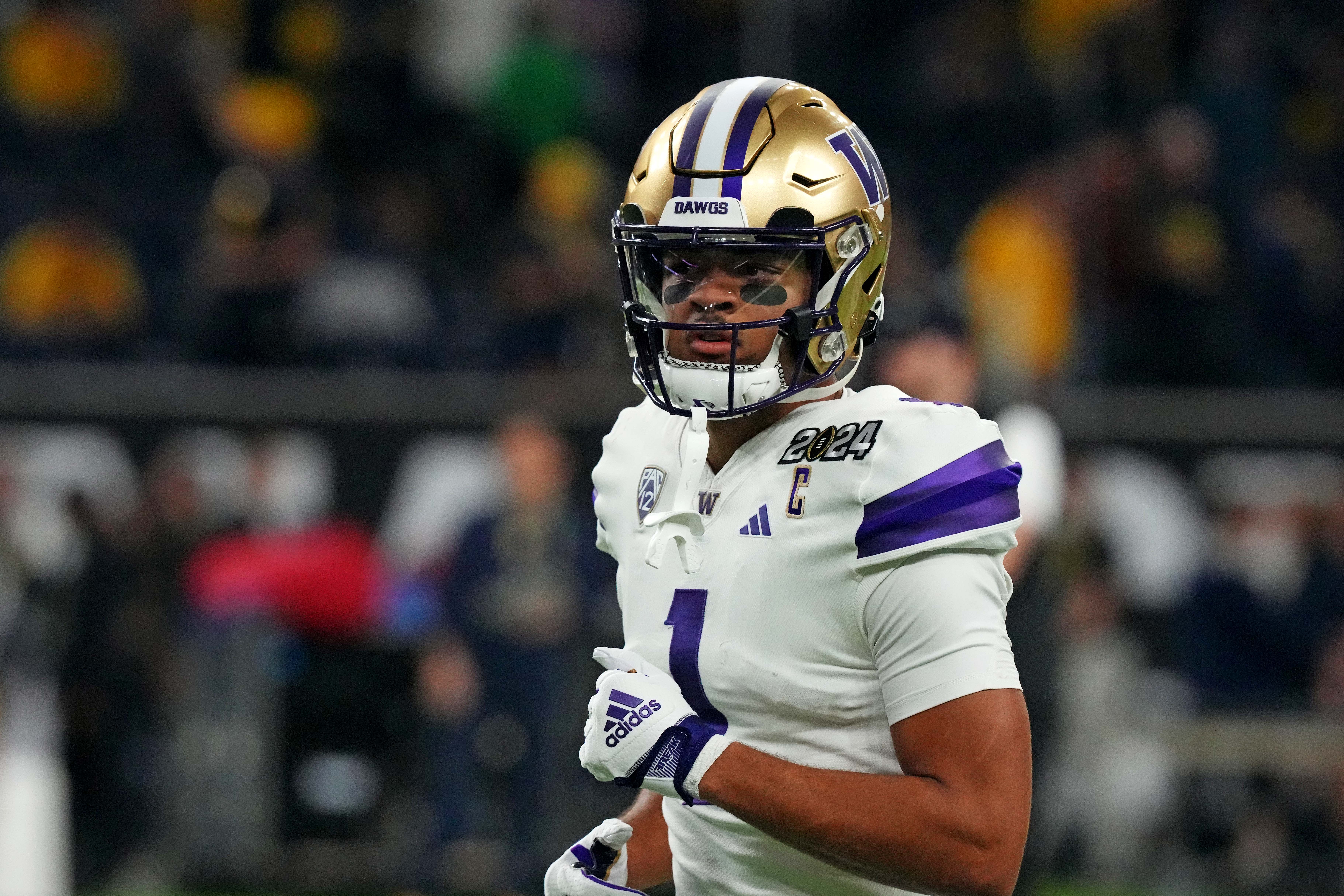 Jan 8, 2024; Houston, TX, USA; Washington Huskies wide receiver Rome Odunze (1) warms up before playing against the Michigan Wolverines in the 2024 College Football Playoff national championship game at NRG Stadium.