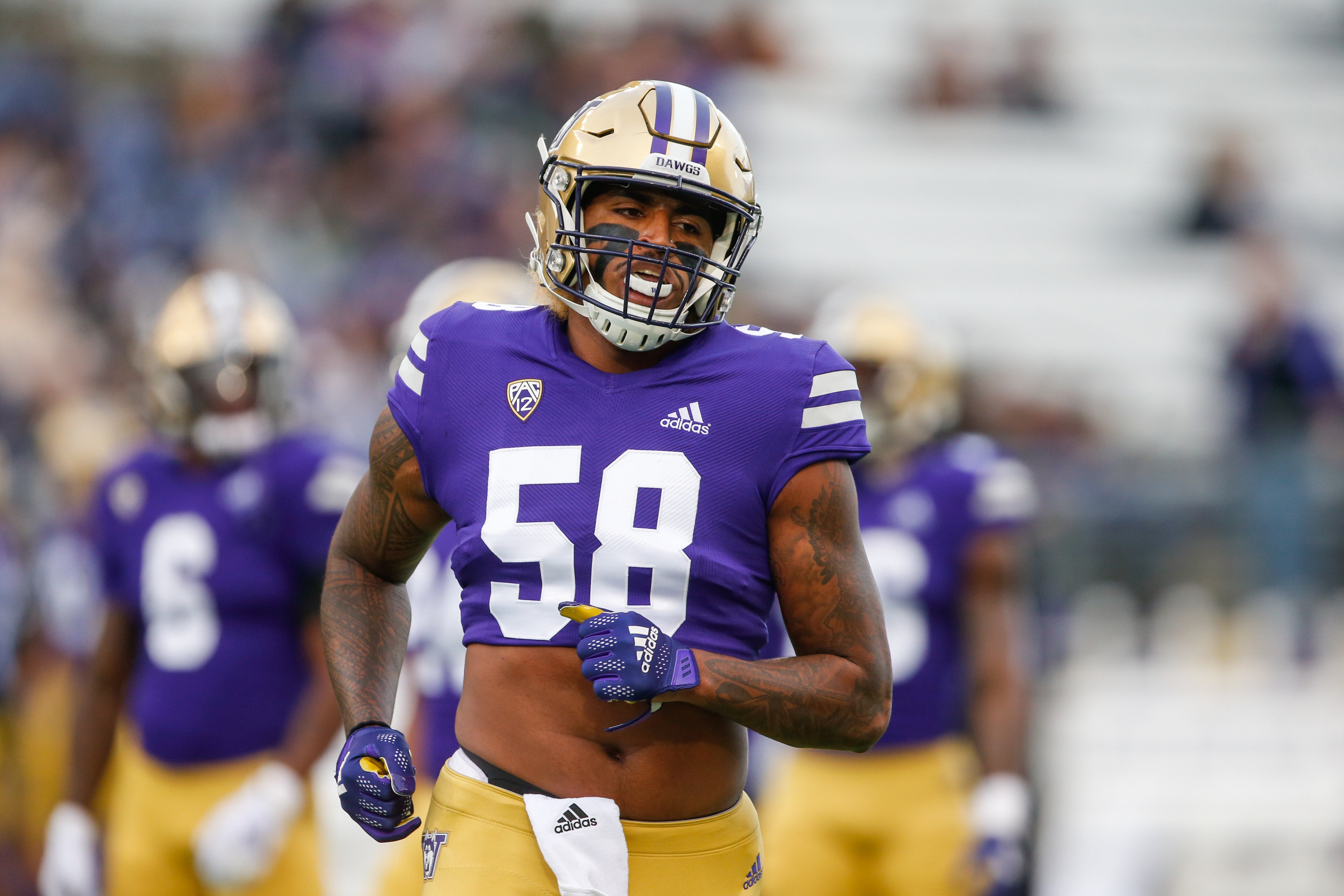 Oct 16, 2021; Seattle, Washington, USA; Washington Huskies linebacker Zion Tupuola-Fetui (58) participates in pregame warmups against the UCLA Bruins at Alaska Airlines Field at Husky Stadium.