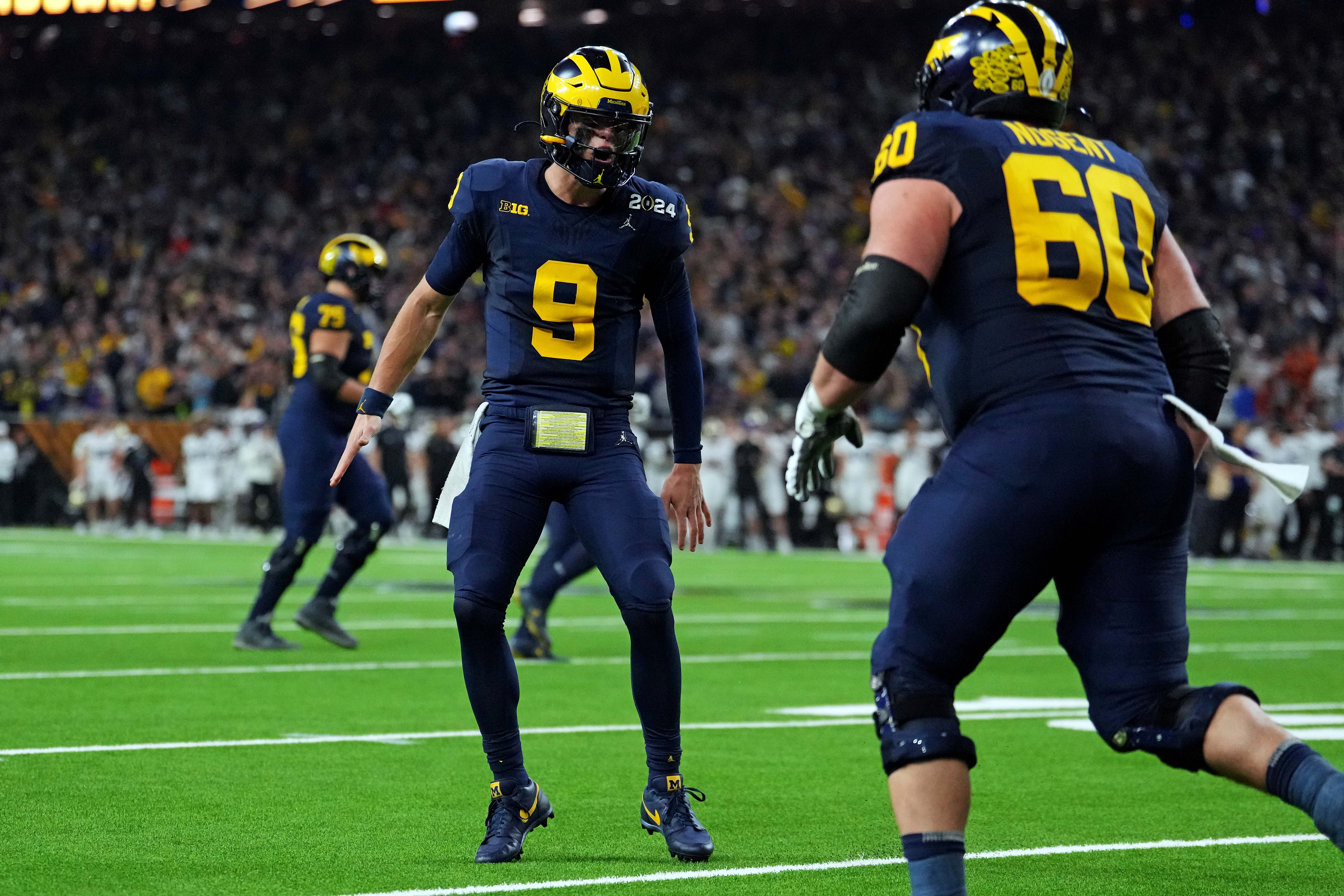 Jan 8, 2024; Houston, TX, USA; Michigan Wolverines quarterback J.J. McCarthy (9) celebrates after a touchdown during the fourth quarter against the Washington Huskies in the 2024 College Football Playoff national championship game at NRG Stadium. Mandatory Credit: Kirby Lee-USA TODAY Sports