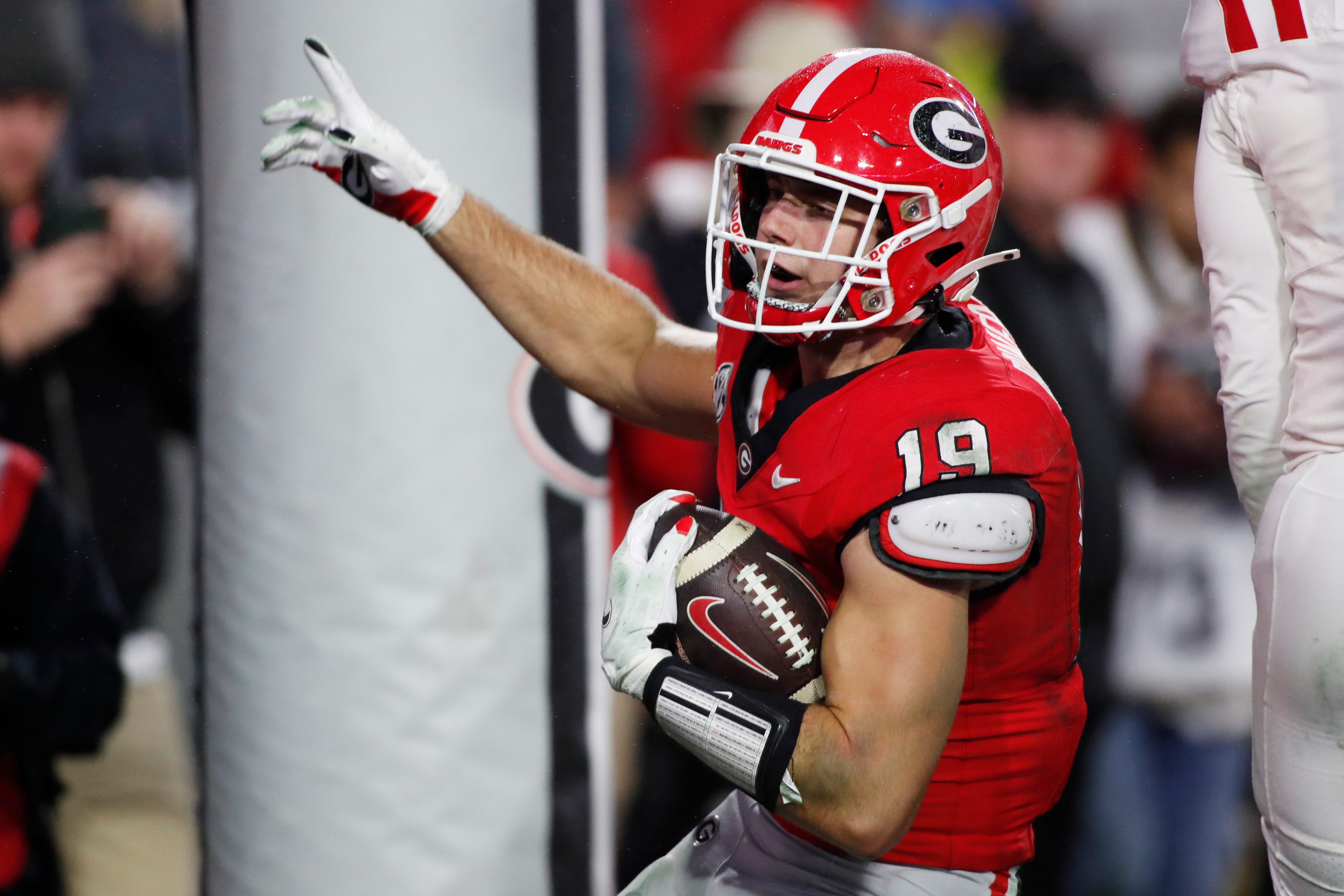 Georgia tight end Brock Bowers (19) scores a touchdown during the second half of a NCAA college football game against Ole Miss in Athens, Ga., on Saturday, Nov. 11, 2023. Georgia won 52-17.