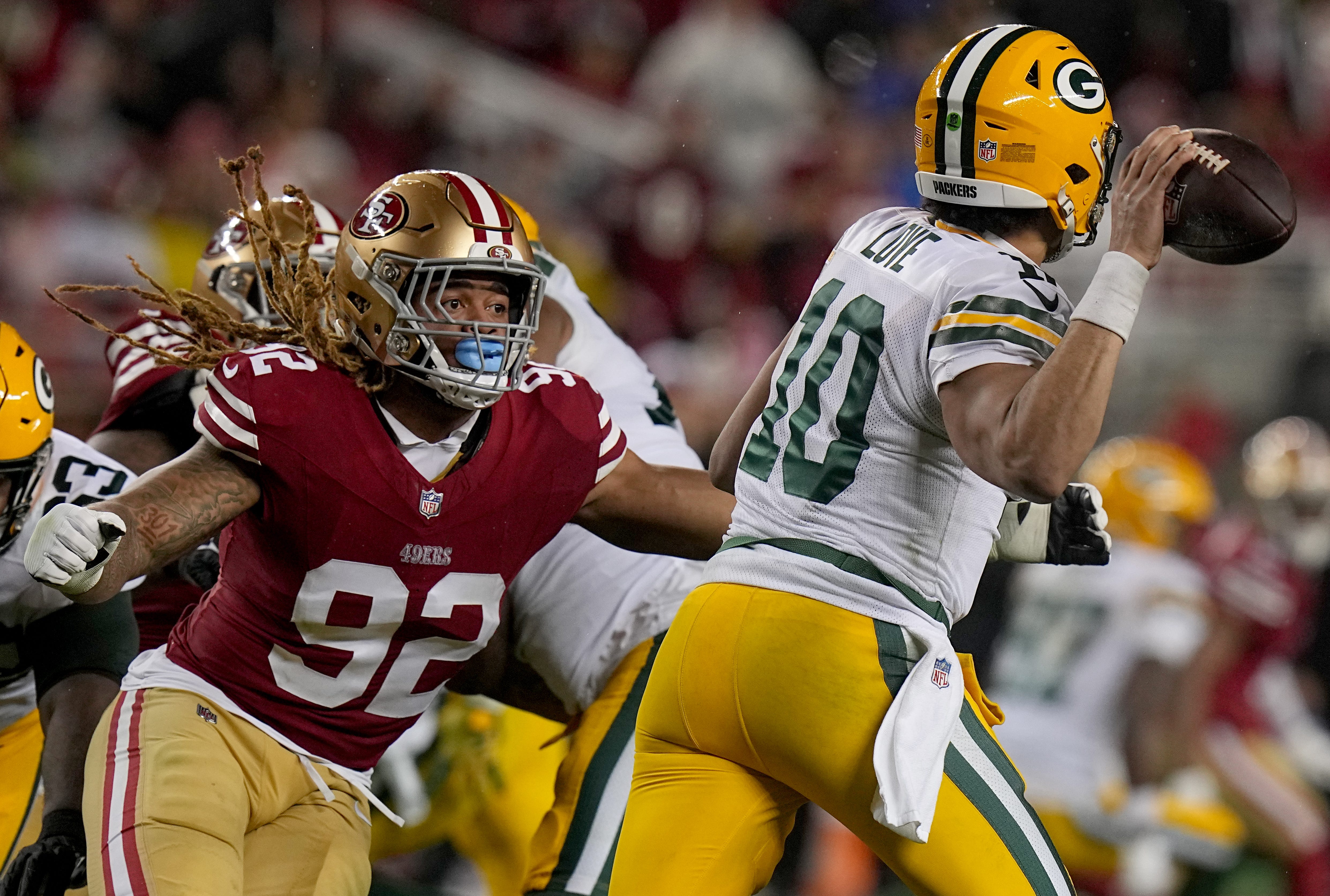 San Francisco 49ers defensive end Chase Young (92) pressures Green Bay Packers quarterback Jordan Love (10) during the third quarter of their NFC divisional playoff game Saturday, January 20, 2024 at Levi Stadium in Santa Clara, California.