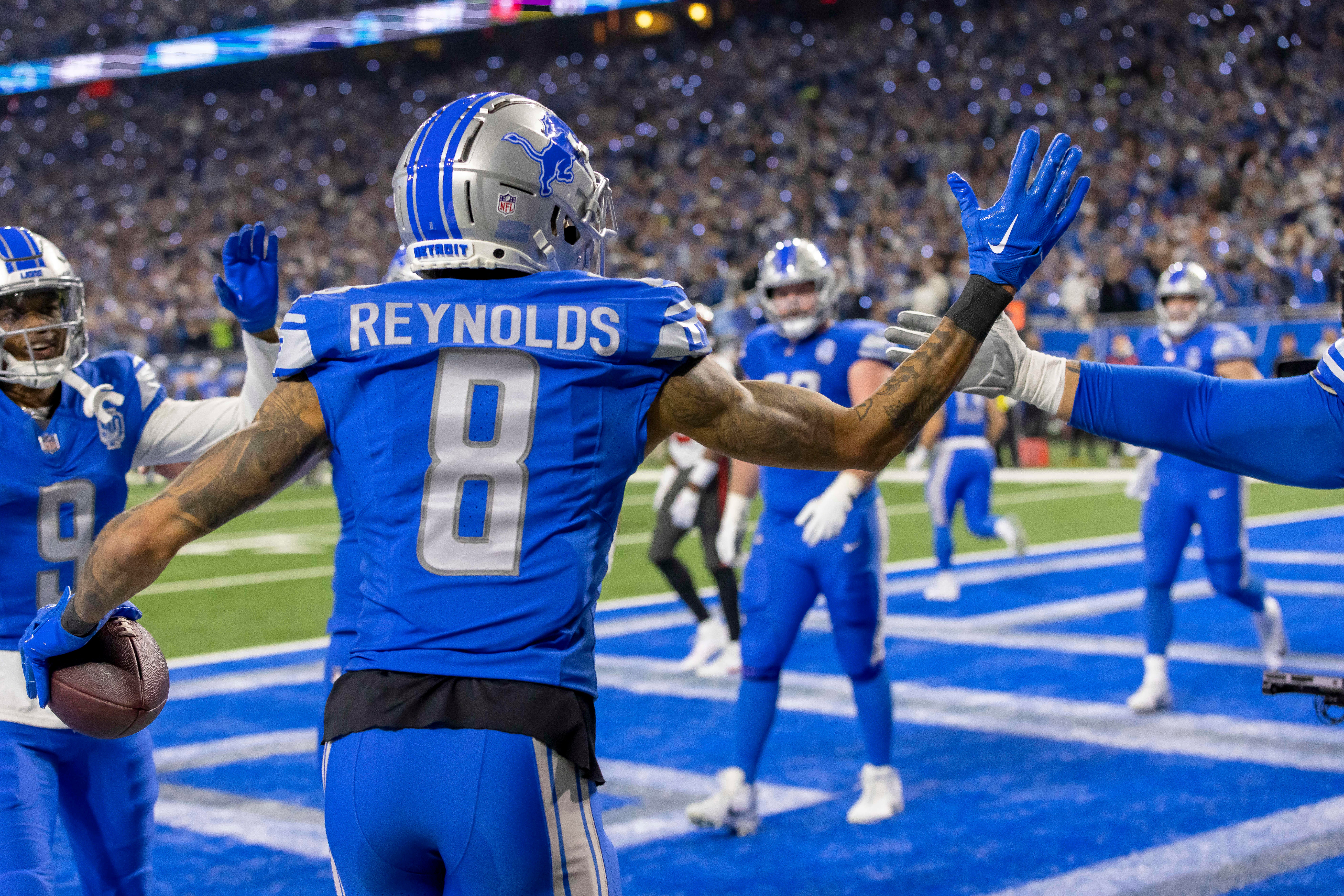 Jan 21, 2024; Detroit, Michigan, USA; Detroit Lions wide receiver Josh Reynolds (8) celebrates with teammates after scoring a touchdown against the Tampa Bay Buccaneers during the first half in a 2024 NFC divisional round game at Ford Field.