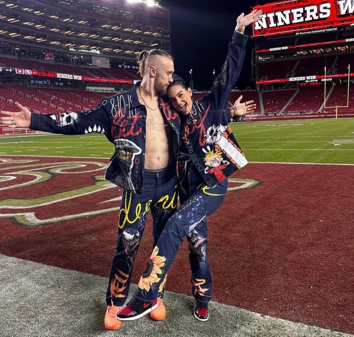 George Kittle and Claire Kittle in custom made outfits by Ty Christian at the 49ers-Packers game