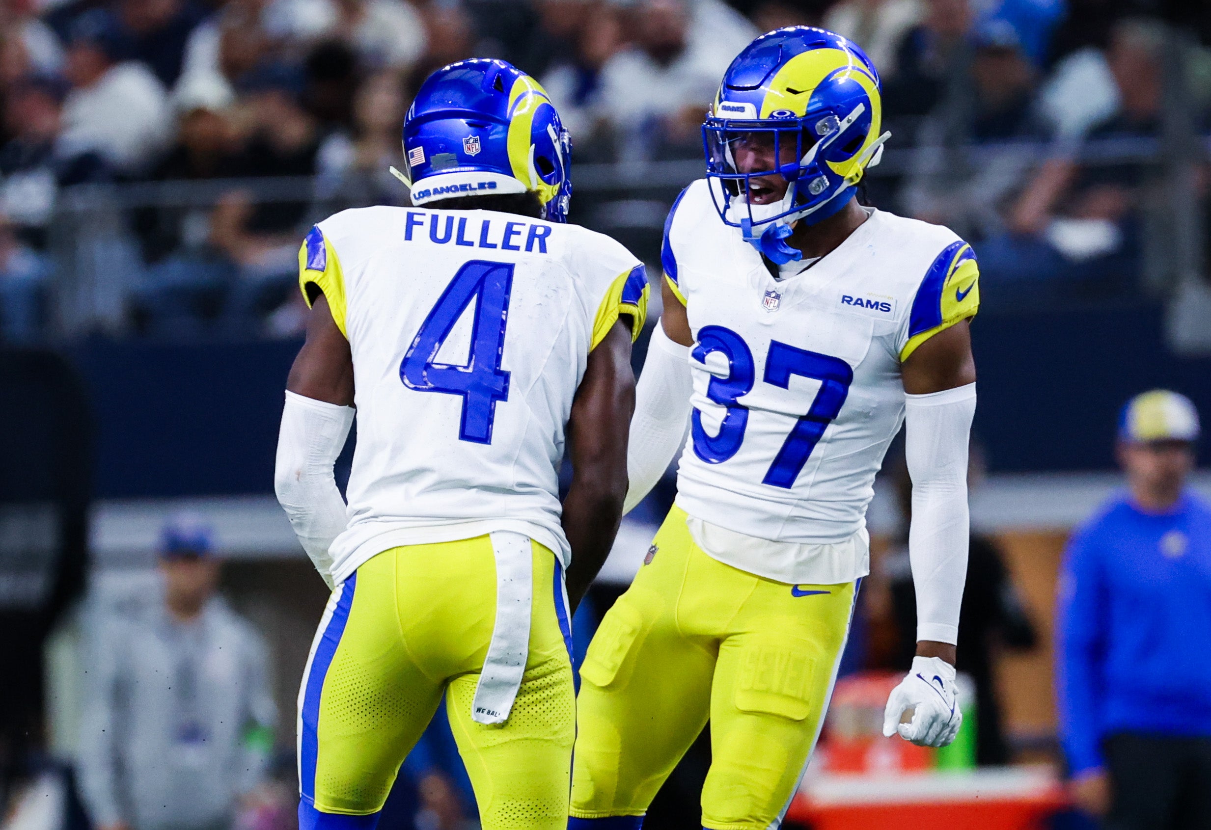 Oct 29, 2023; Arlington, Texas, USA; Los Angeles Rams safety Jordan Fuller (4) celebrates with Los Angeles Rams safety Quentin Lake (37) after making an interception during the first half against the Dallas Cowboys at AT&T Stadium. Mandatory Credit: Kevin Jairaj-USA TODAY Sports