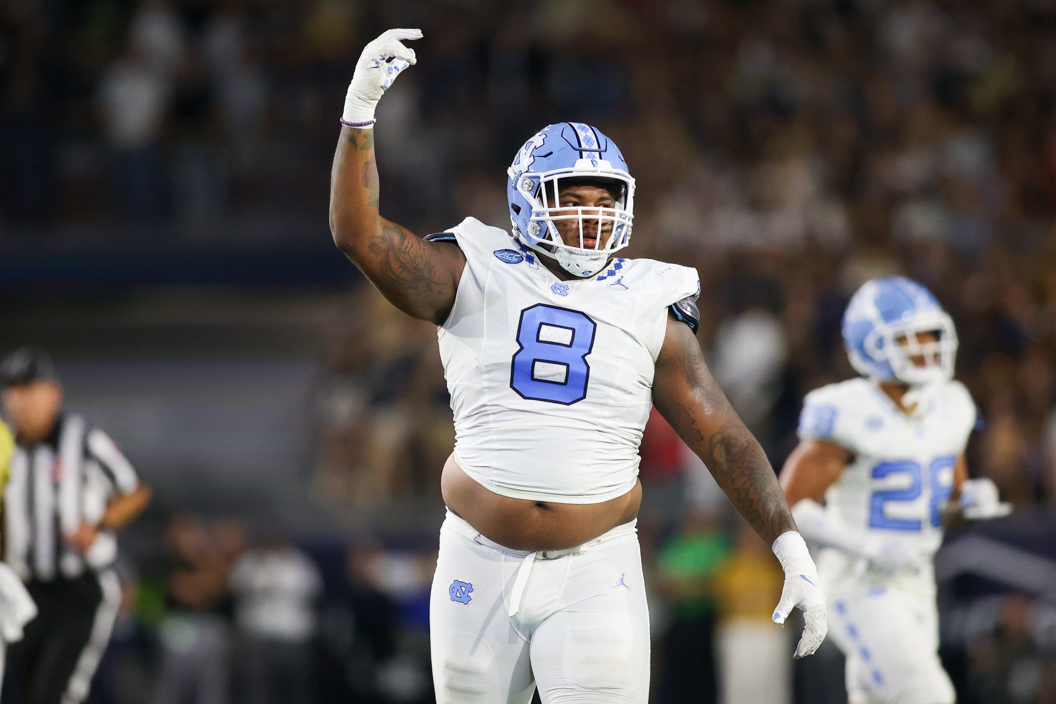 Oct 28, 2023; Atlanta, Georgia, USA; North Carolina Tar Heels defensive lineman Myles Murphy (8) reacts after a turnover on downs against the Georgia Tech Yellow Jackets in the first half at Bobby Dodd Stadium at Hyundai Field.