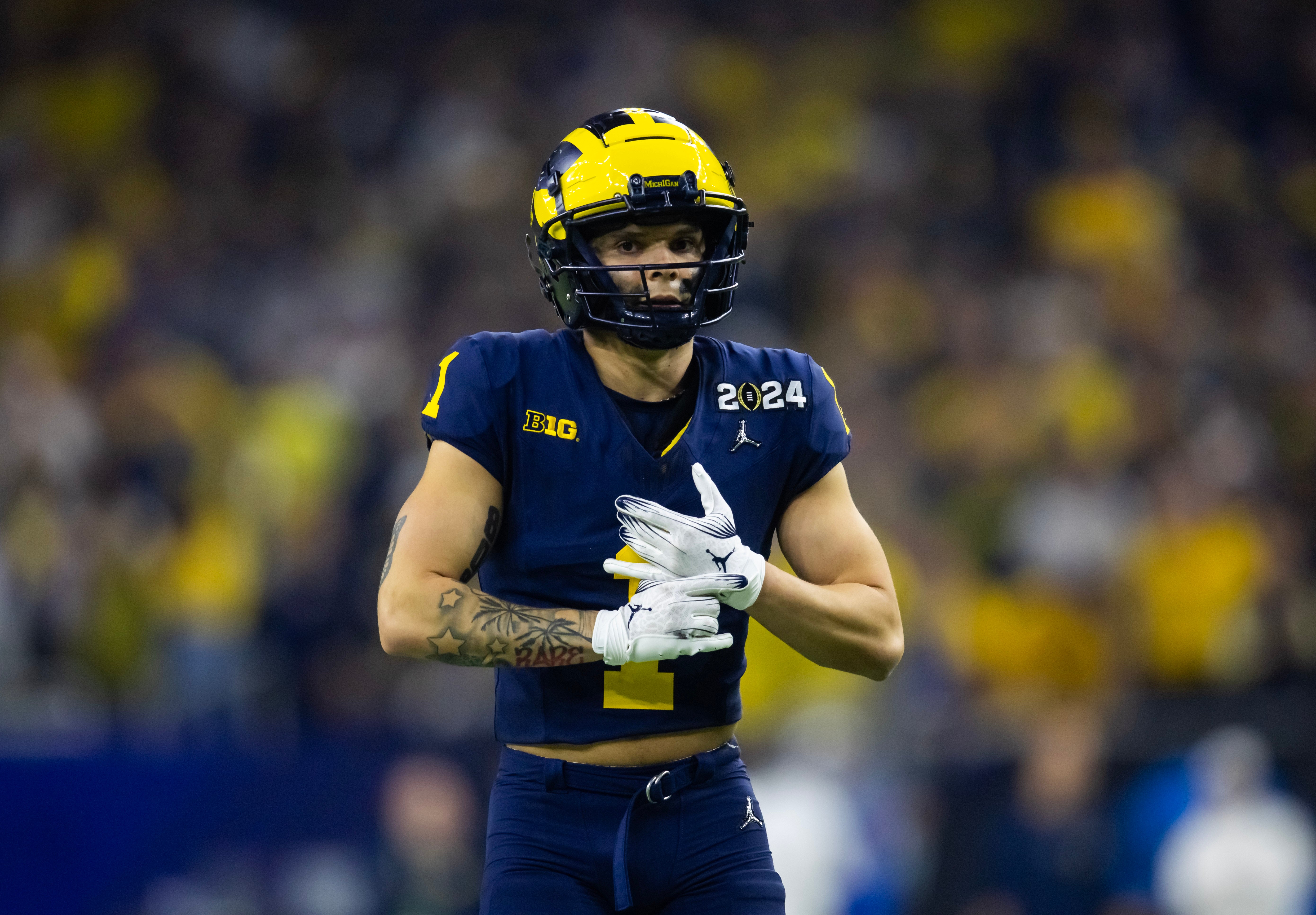 Jan 8, 2024; Houston, TX, USA; Michigan Wolverines wide receiver Roman Wilson (1) against the Washington Huskies during the 2024 College Football Playoff national championship game at NRG Stadium.