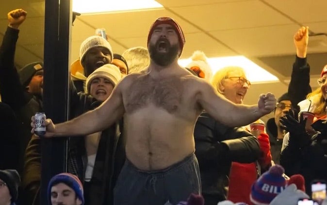 Jason Kelce celebrates in the crowd after the Kansas City Chiefs score against the Buffalo Bills during the first half for the 2024 AFC divisional round game at Highmark Stadium.