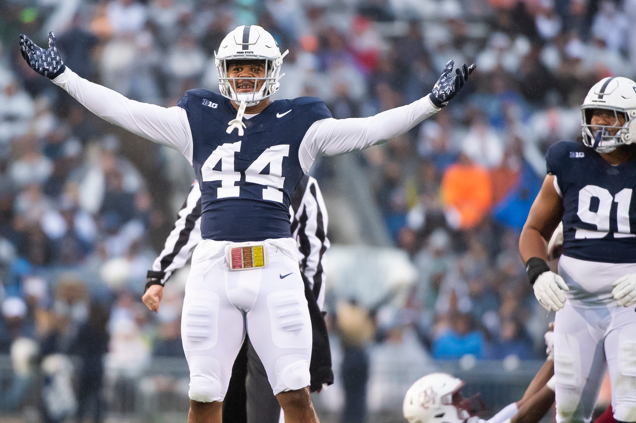 Penn State defensive end Chop Robinson (44) celebrates after sacking Massachusetts quarterback Taisun Phommachanh in the first half of a NCAA football game Saturday, Oct. 14, 2023, in State College, Pa. The Nittany Lions won, 63-0.  
