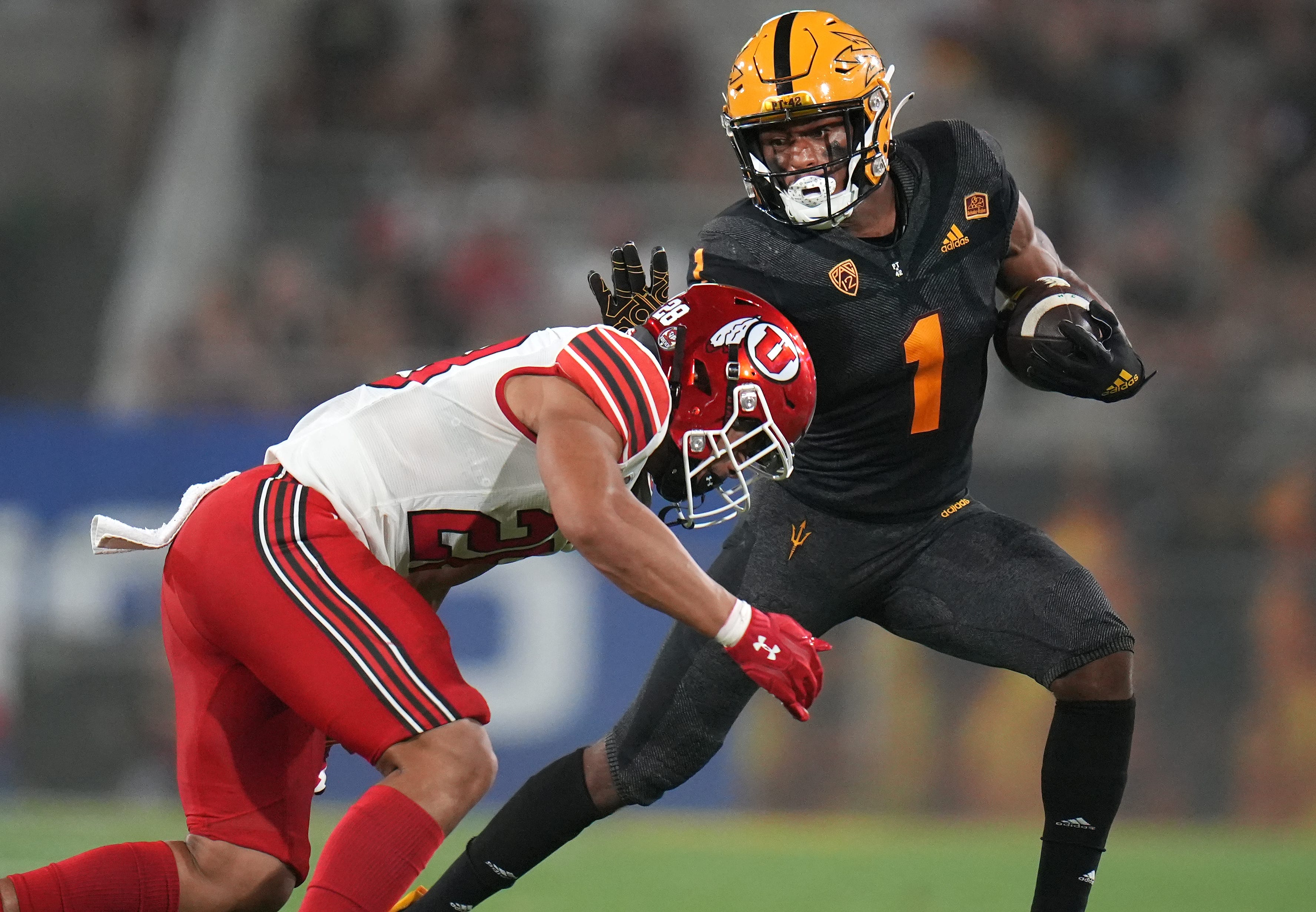 Sep 24, 2022; Tempe, Arizona, USA; ASU running back Xazavian Valladay (1) attempts to stiff arm Utah defender Sione Vaki (28) at Sun Devil Stadium on Saturday. Football Utah Asu Utah At Asu  