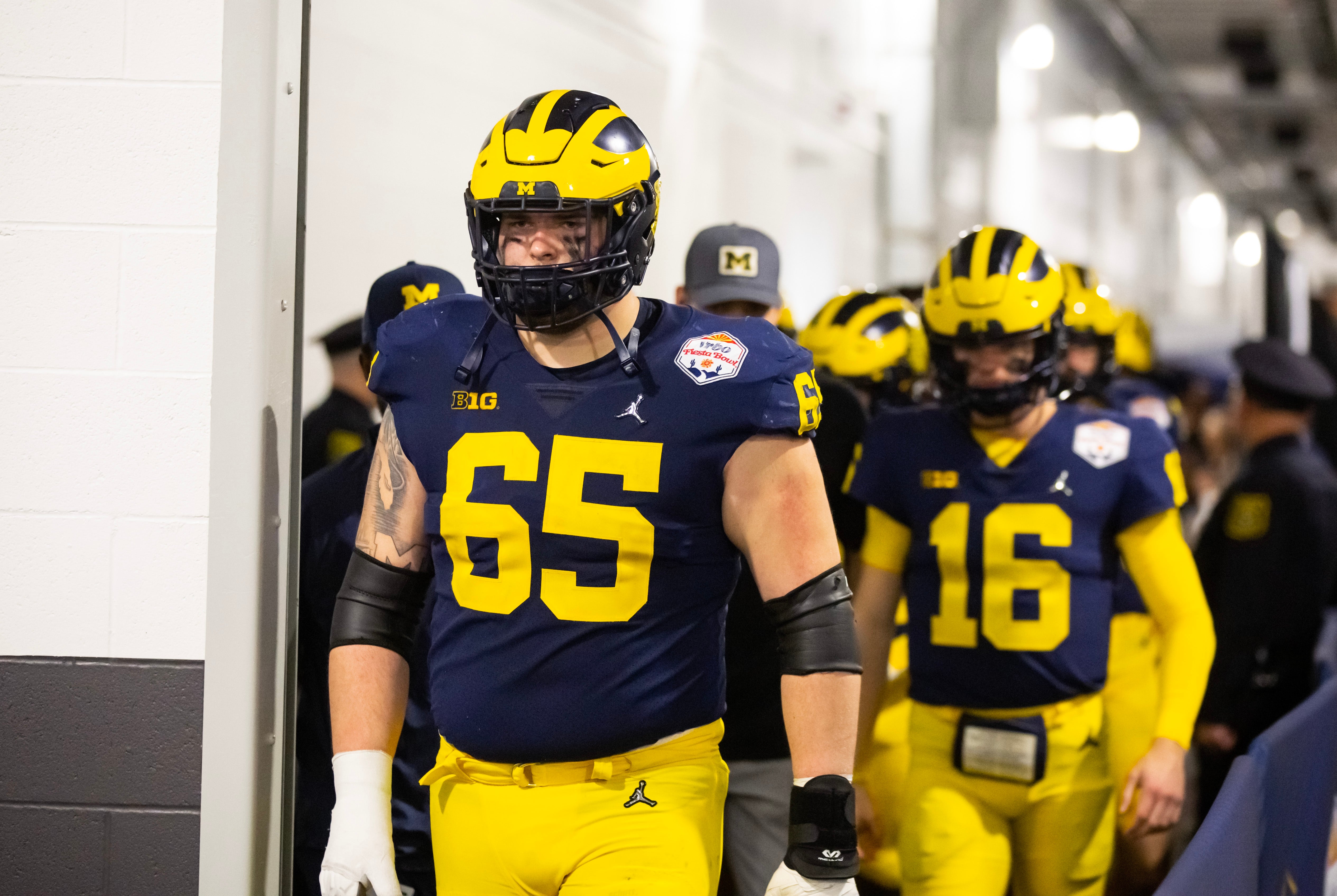 Michigan Wolverines offensive lineman Zak Zinter (65) against the TCU Horned Frogs during the 2022 Fiesta Bowl at State Farm Stadium.