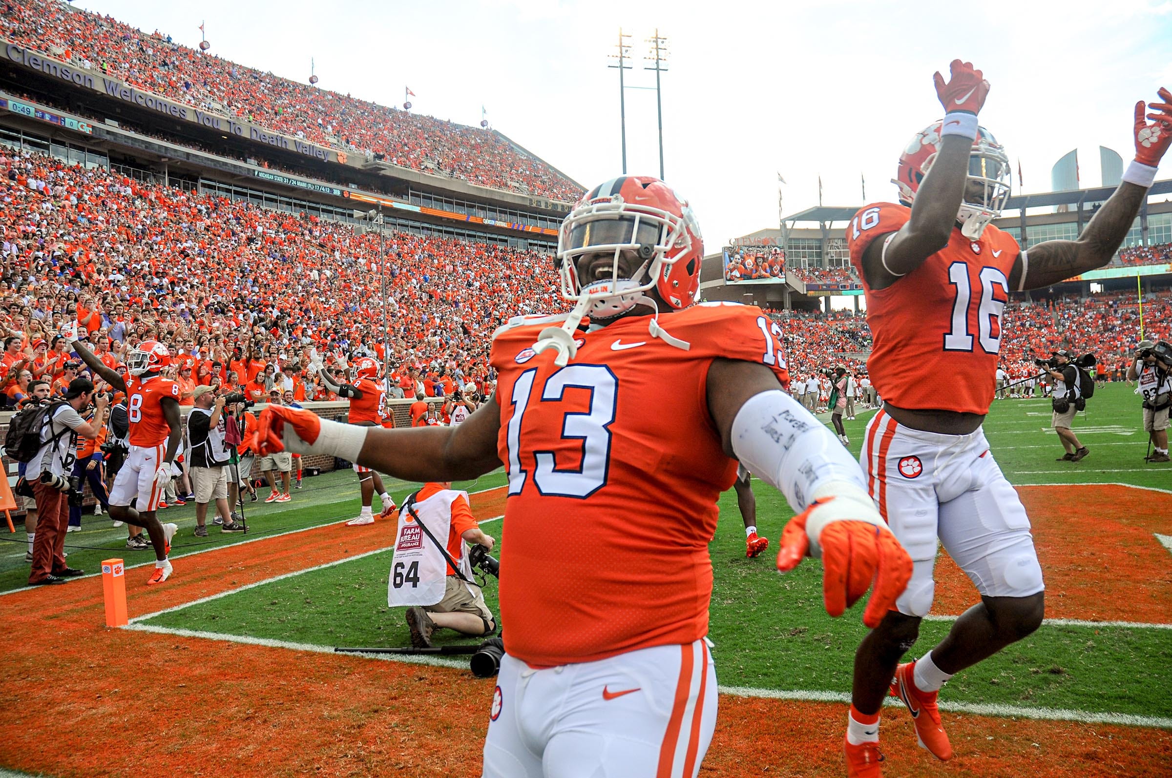 Clemson defensive tackle Tyler Davis (13) and teammates get fans louder before the game with Georgia Tech in Clemson, S.C., September 18, 2021. Ncaa Football Georgia Tech At Clemson  