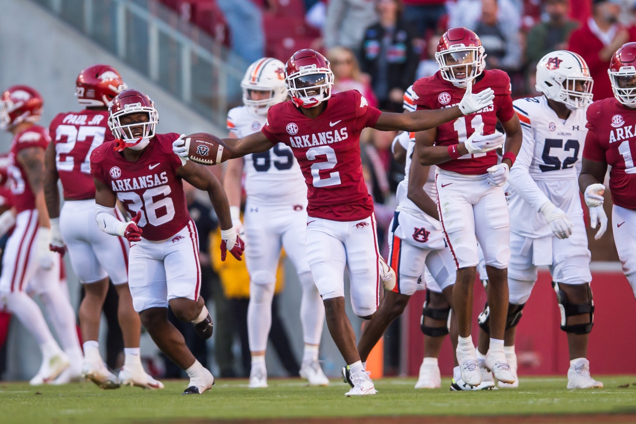 Nov 11, 2023; Fayetteville, Arkansas, USA; Arkansas Razorbacks defensive back Dwight McGlothern (2) celebrates his interception during the first quarter against the Auburn Tigers at Donald W. Reynolds Razorback Stadium.