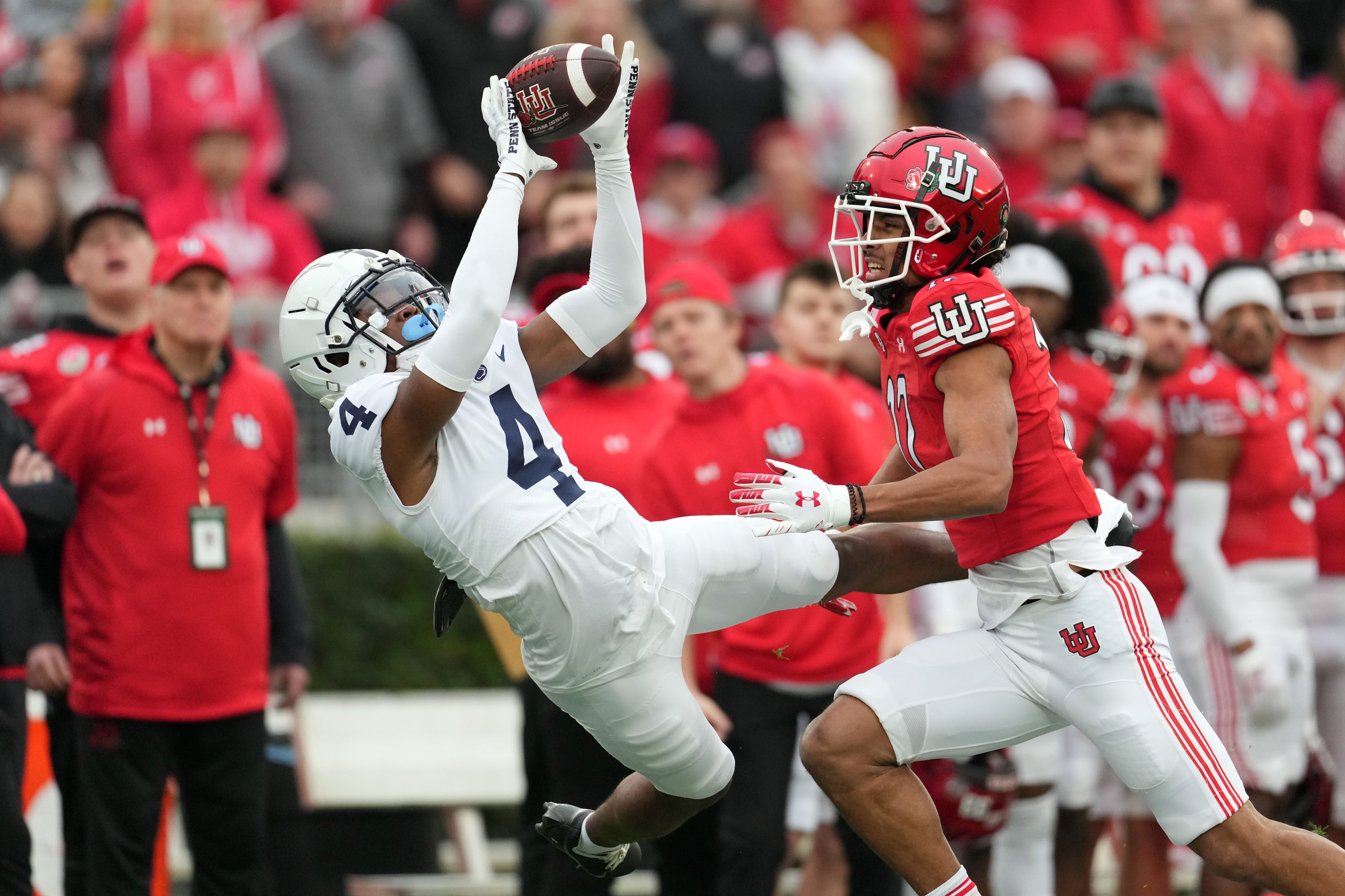 Jan 2, 2023; Pasadena, California, USA; Penn State Nittany Lions cornerback Kalen King (4) makes an catch against Utah Utes wide receiver Devaughn Vele (17) in the first half of the 109th Rose Bowl game at the Rose Bowl.