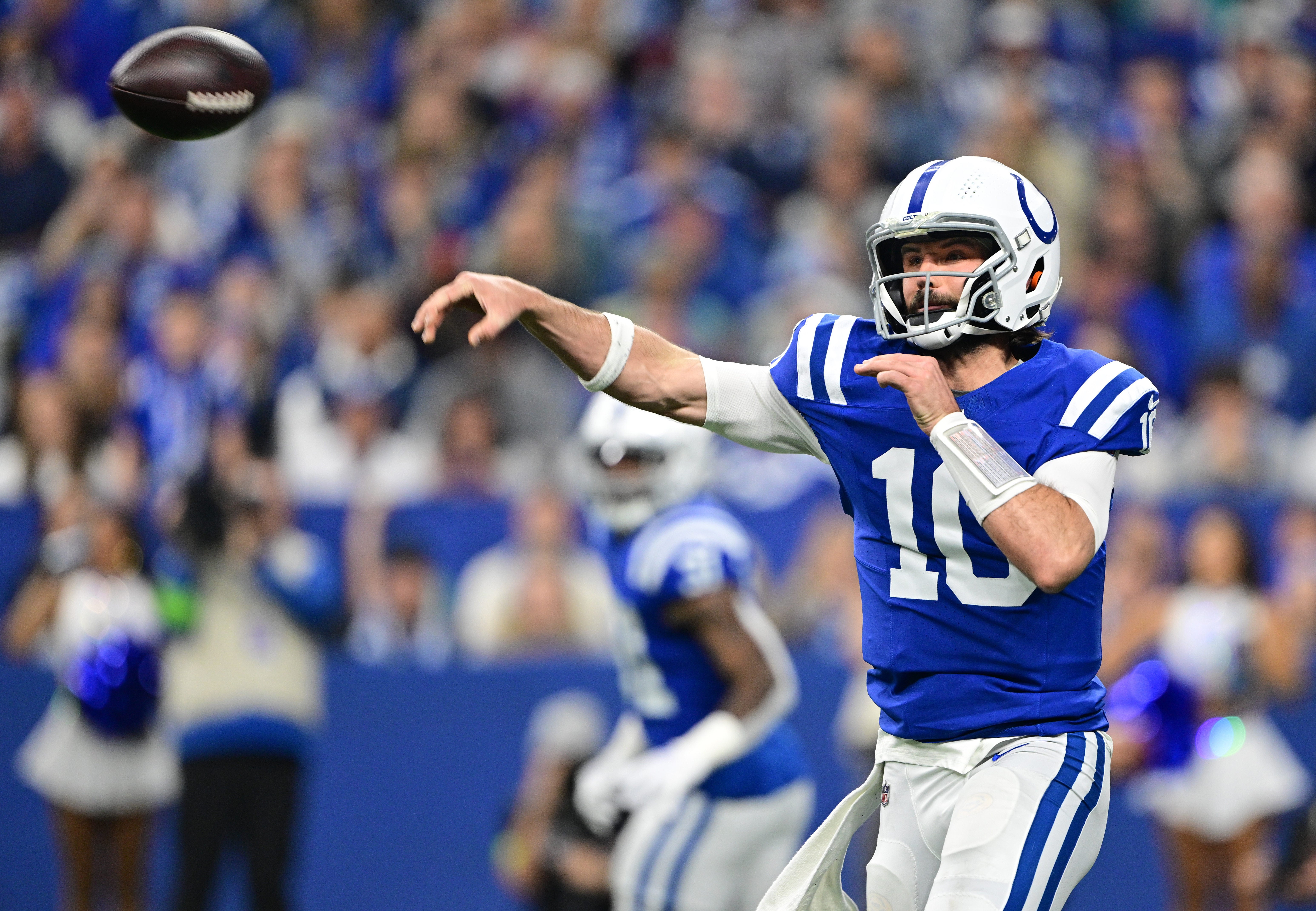 Jan 6, 2024; Indianapolis, Indiana, USA; Indianapolis Colts quarterback Gardner Minshew (10) throws a pass against the Houston Texans during the first quarter at Lucas Oil Stadium.