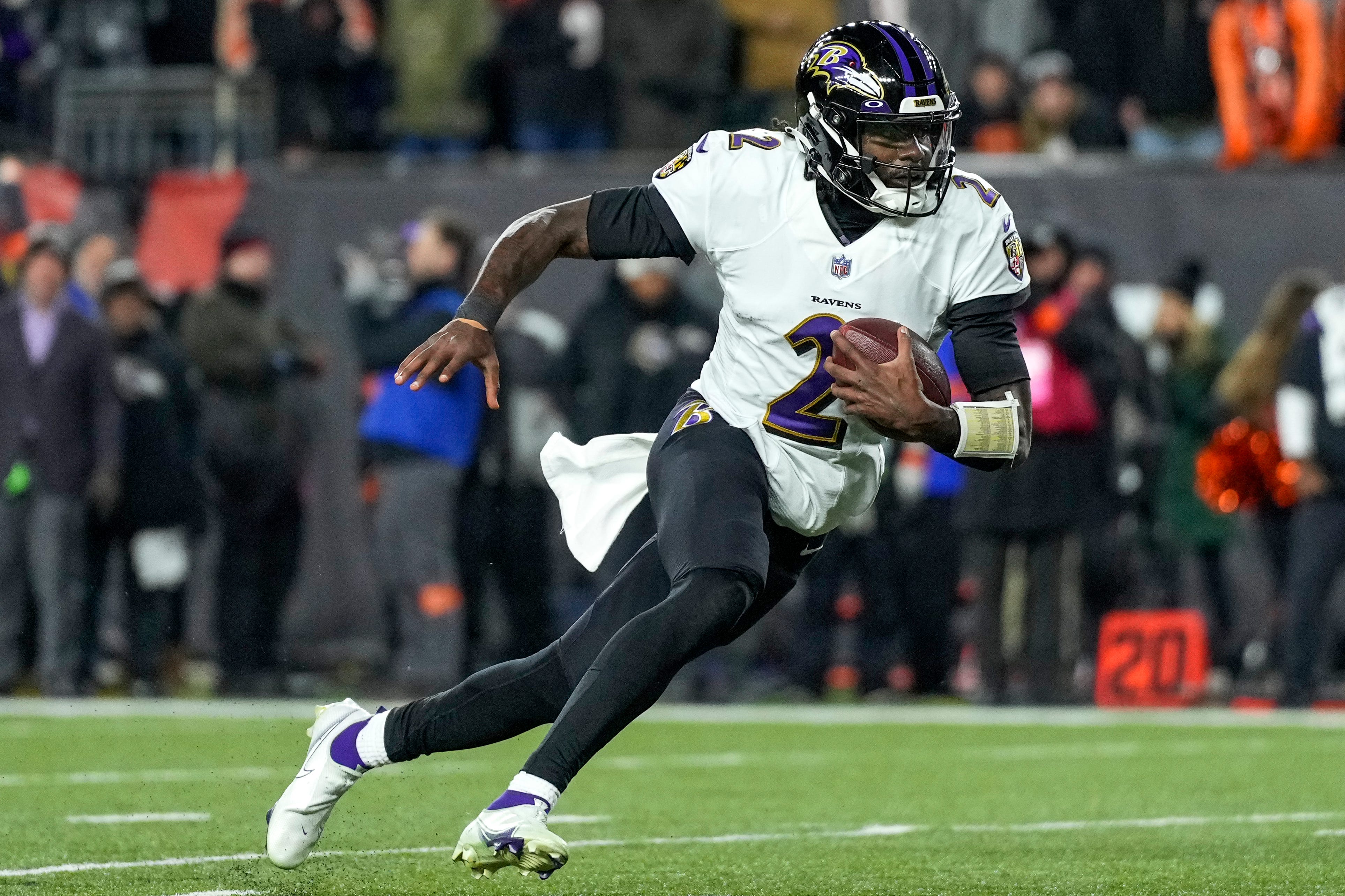Baltimore Ravens quarterback Tyler Huntley (2) scrambles out of the pocket in the second quarter during an NFL wild-card playoff football game between the Baltimore Ravens and the Cincinnati Bengals, Sunday, Jan. 15, 2023, at Paycor Stadium in Cincinnati. The Ravens led 10-9 at halftime. Baltimore Ravens At Cincinnati Bengals Afc Wild Card Jan 15