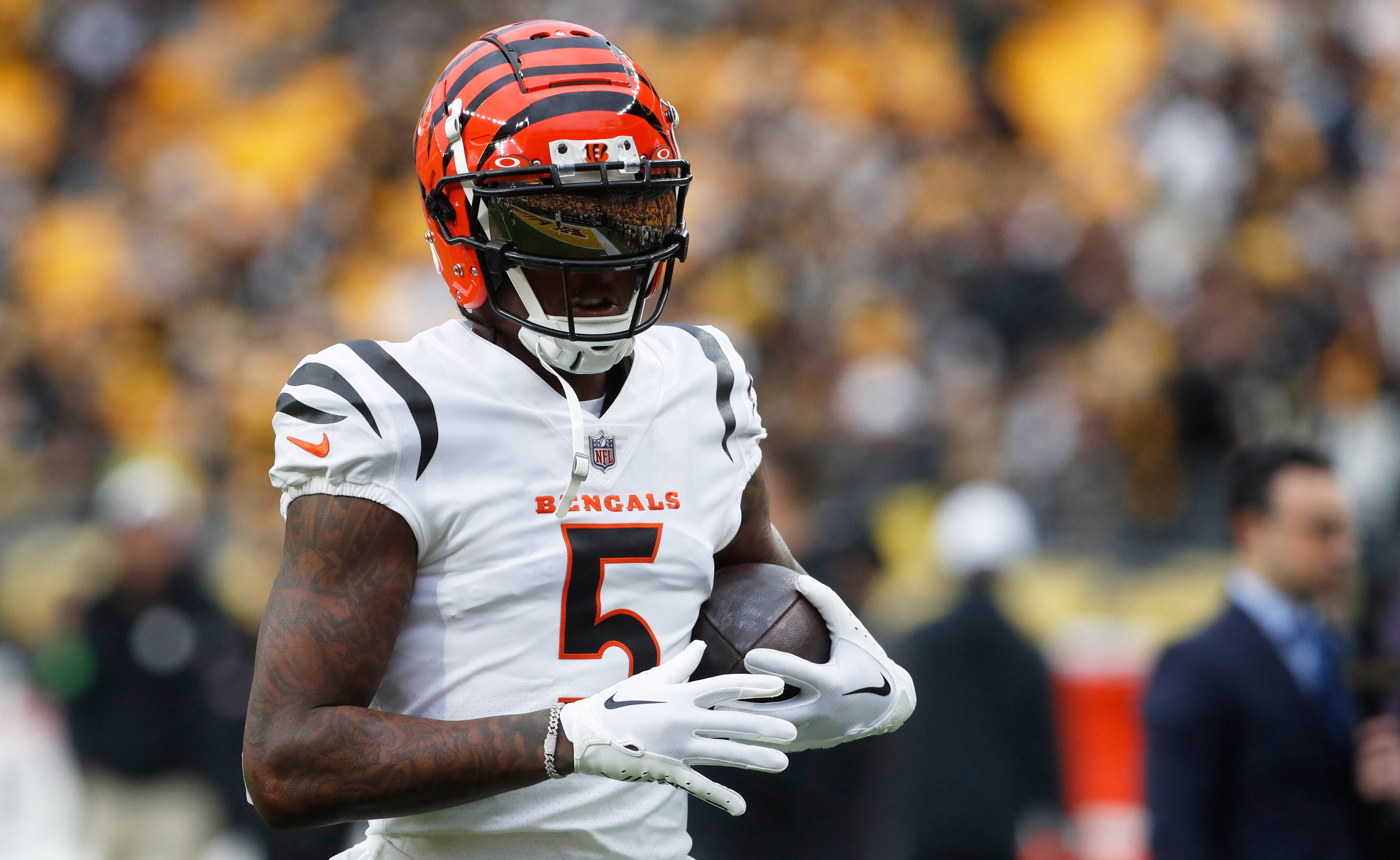 Dec 23, 2023; Pittsburgh, Pennsylvania, USA; Cincinnati Bengals wide receiver Tee Higgins (5) warms up before the game against the Pittsburgh Steelers at Acrisure Stadium. Mandatory Credit: Charles LeClaire-USA TODAY Sports