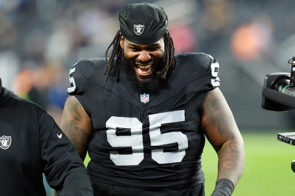 Las Vegas Raiders defensive tackle John Jenkins (95) smiles after the game against the Los Angeles Chargers at Allegiant Stadium.