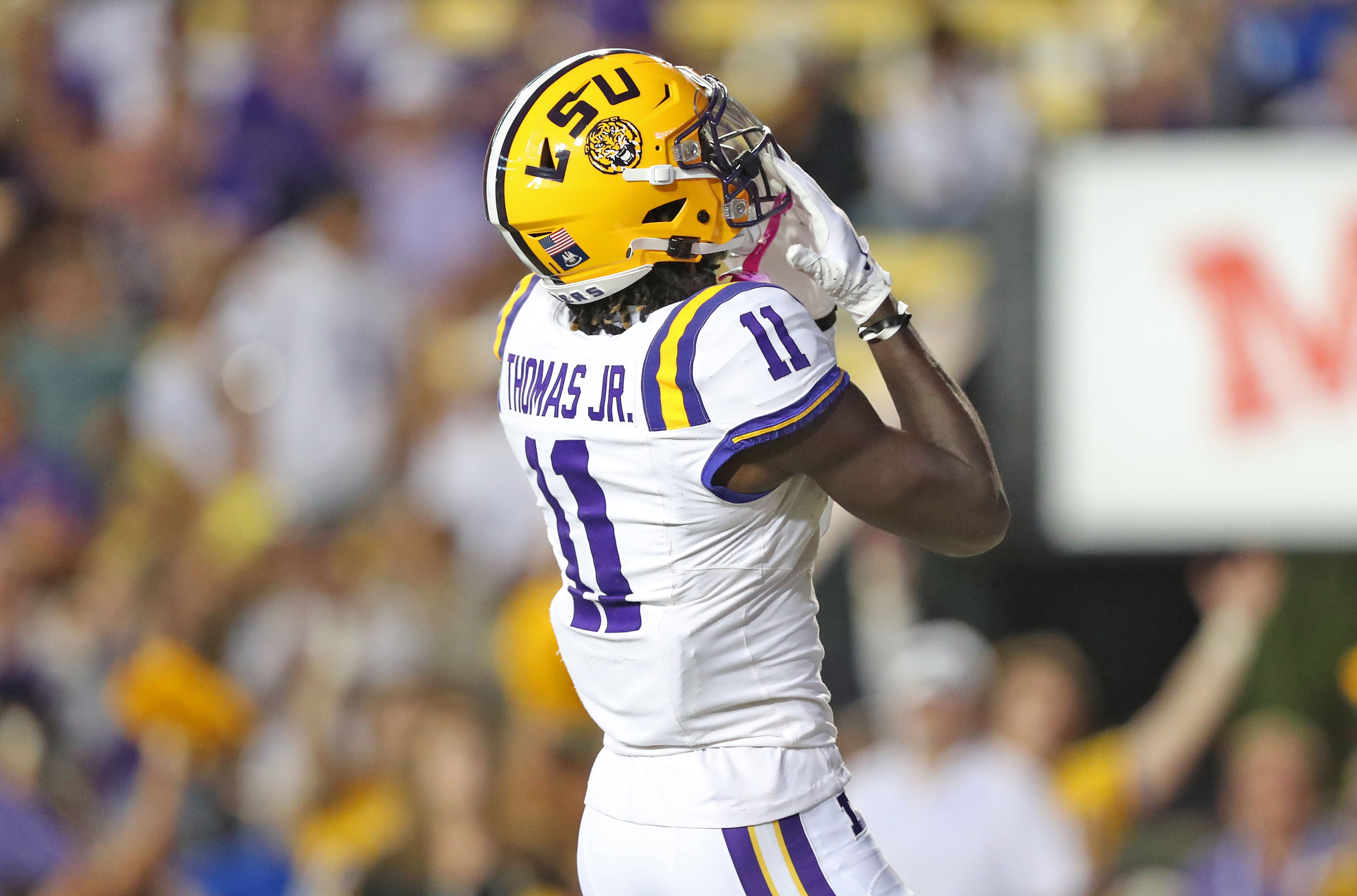 Oct 21, 2023; Baton Rouge, Louisiana, USA; LSU Tigers wide receiver Brian Thomas Jr. (11) celebrates his touchdown catch against the Army Black Knights during the first half at Tiger Stadium.