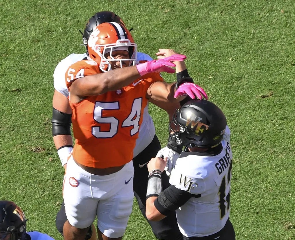 Clemson linebacker Jeremiah Trotter Jr. (54) pressures Wake Forest quarterback Mitch Griffis (12) during the first quarter at Memorial Stadium.