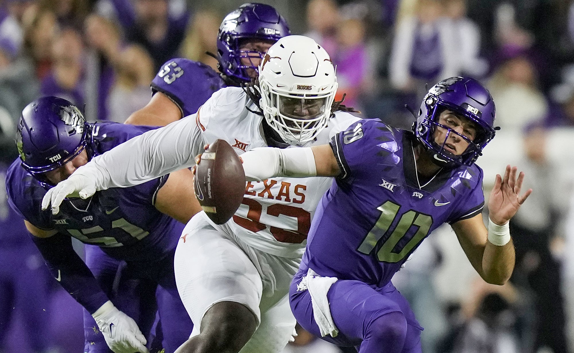 Nov 11, 2023; Fort Worth, Texas, USA; Texas Longhorns defensive lineman T'Vondre Sweat (93) sacks TCU Horned Frogs quarterback Josh Hoover (10) in the first quarter of an NCAA college football game at Amon G. Carter Stadium.